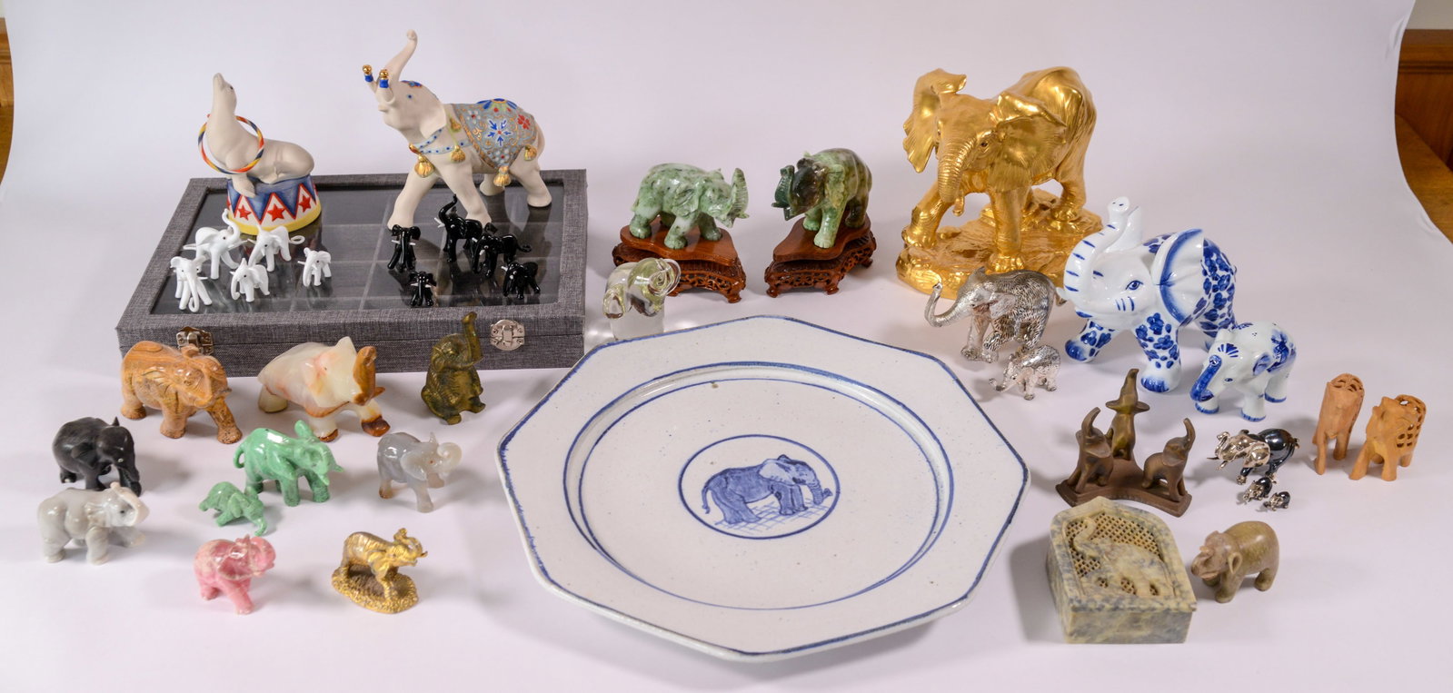 A Herd of Elephants.: Various materials, also includes plate with elephant, signed Lapin 1980, diameter 14 inches.