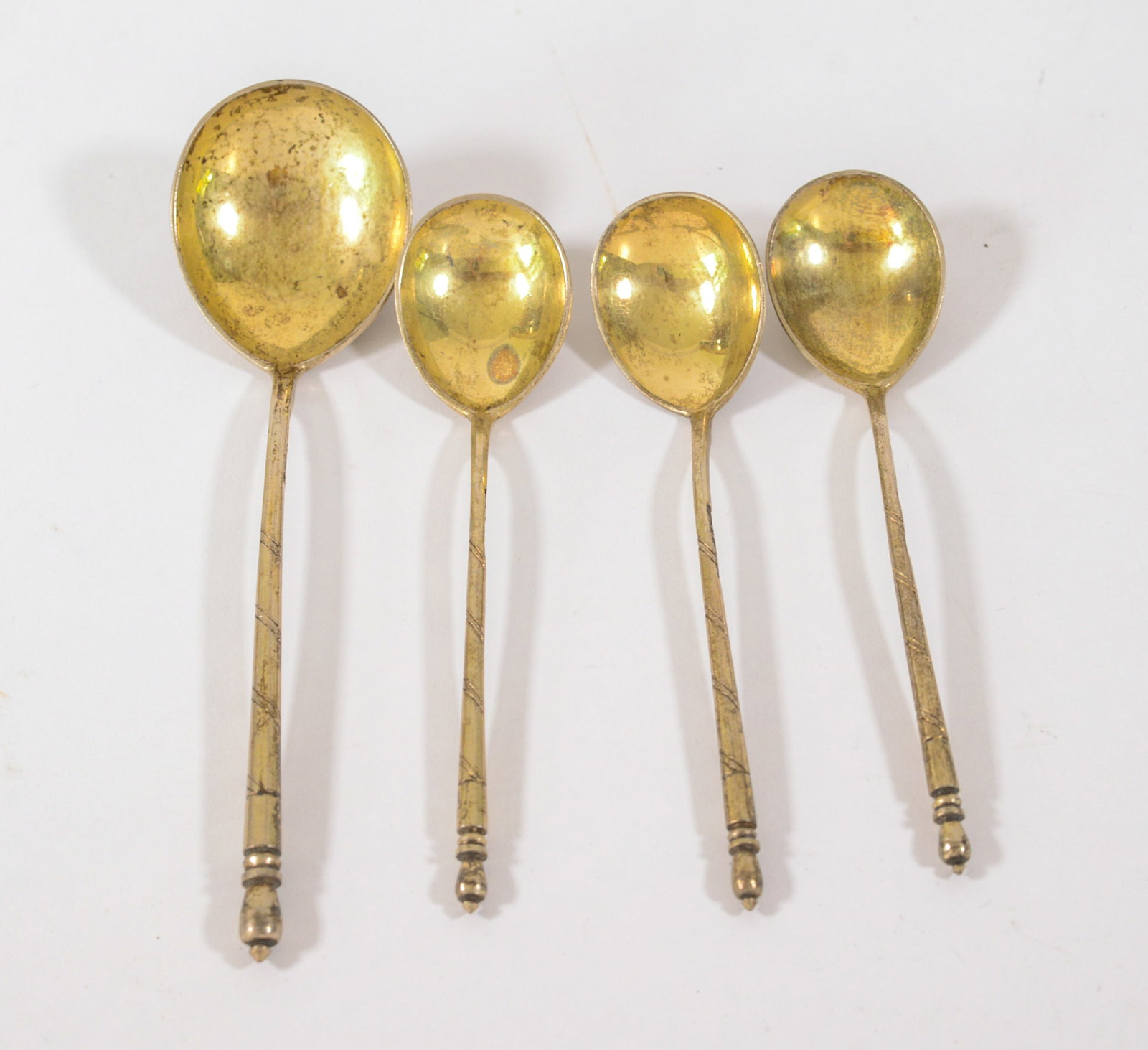 Four Gold Wash Spoons.: Length of longest 6 inches.