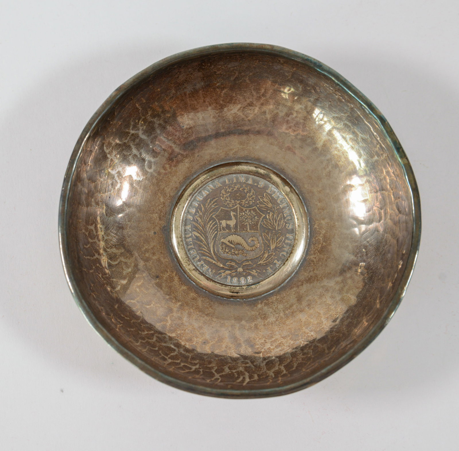 Hammered Silver Bowl With Peruvian 1 Sol Coin.: Diameter 4.25 inches.