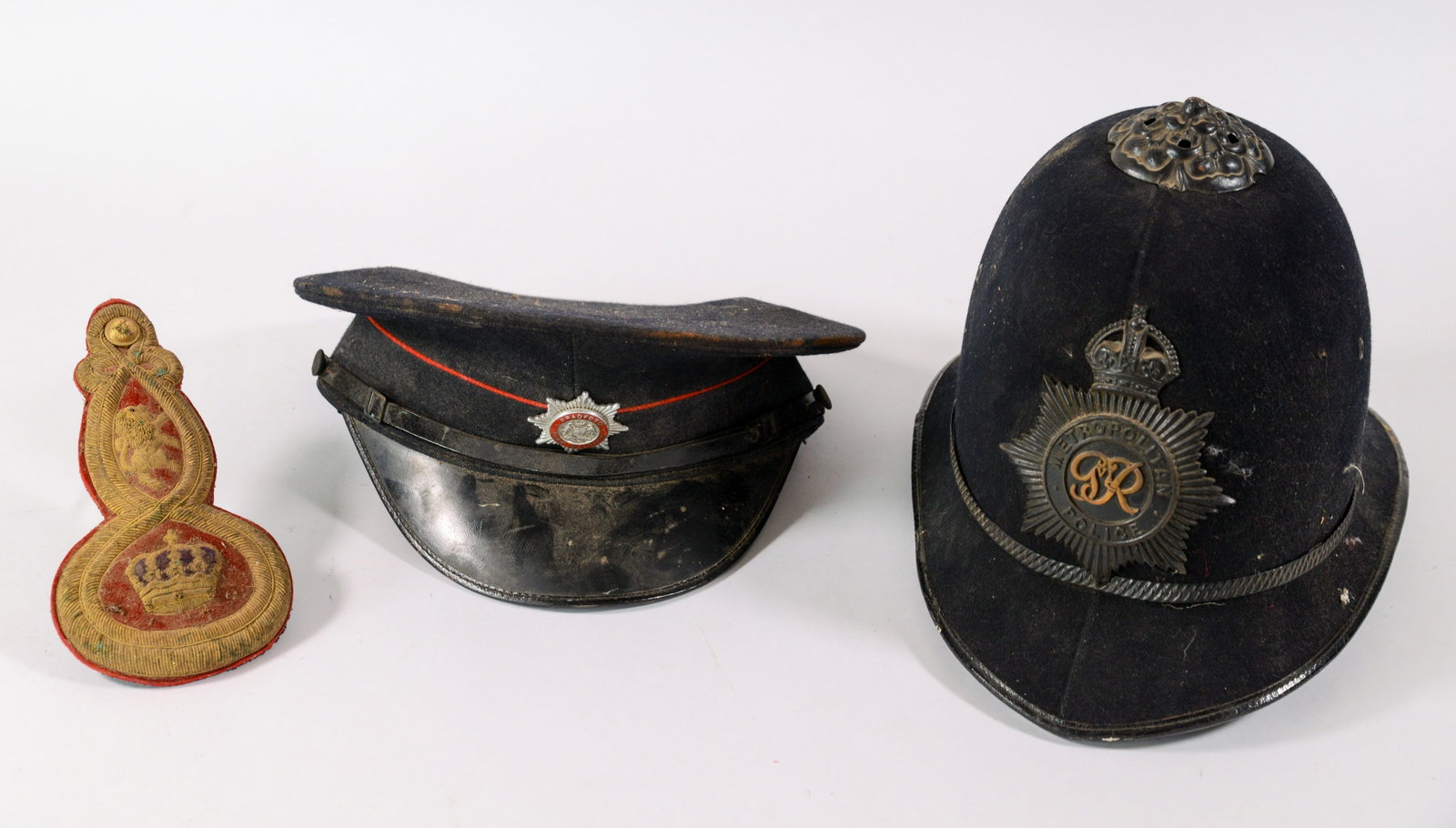 Two Hats: Metropolitan Police and Bradford Fire Brigade.: Together with a Horstman epaulet. Some wear.