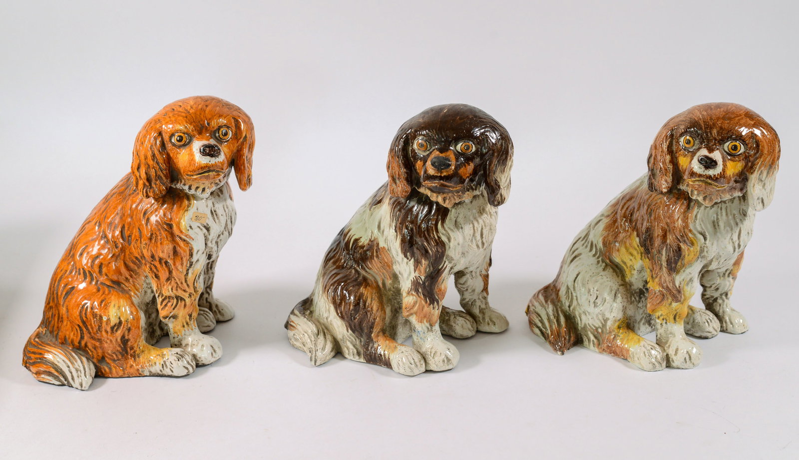 Three Glazed Concrete Dogs.: Heights 10.5 inches.