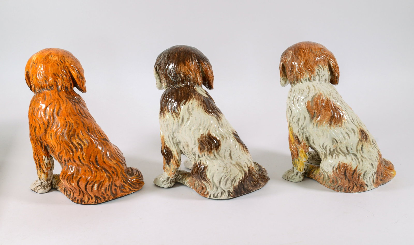 Three Glazed Concrete Dogs. - 2