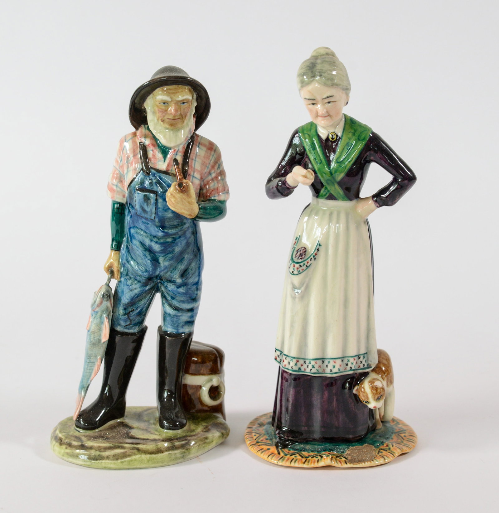 Pair of Curt Porcelain Figures.: Aunt Polly and Fisherman, heights 8 inches.