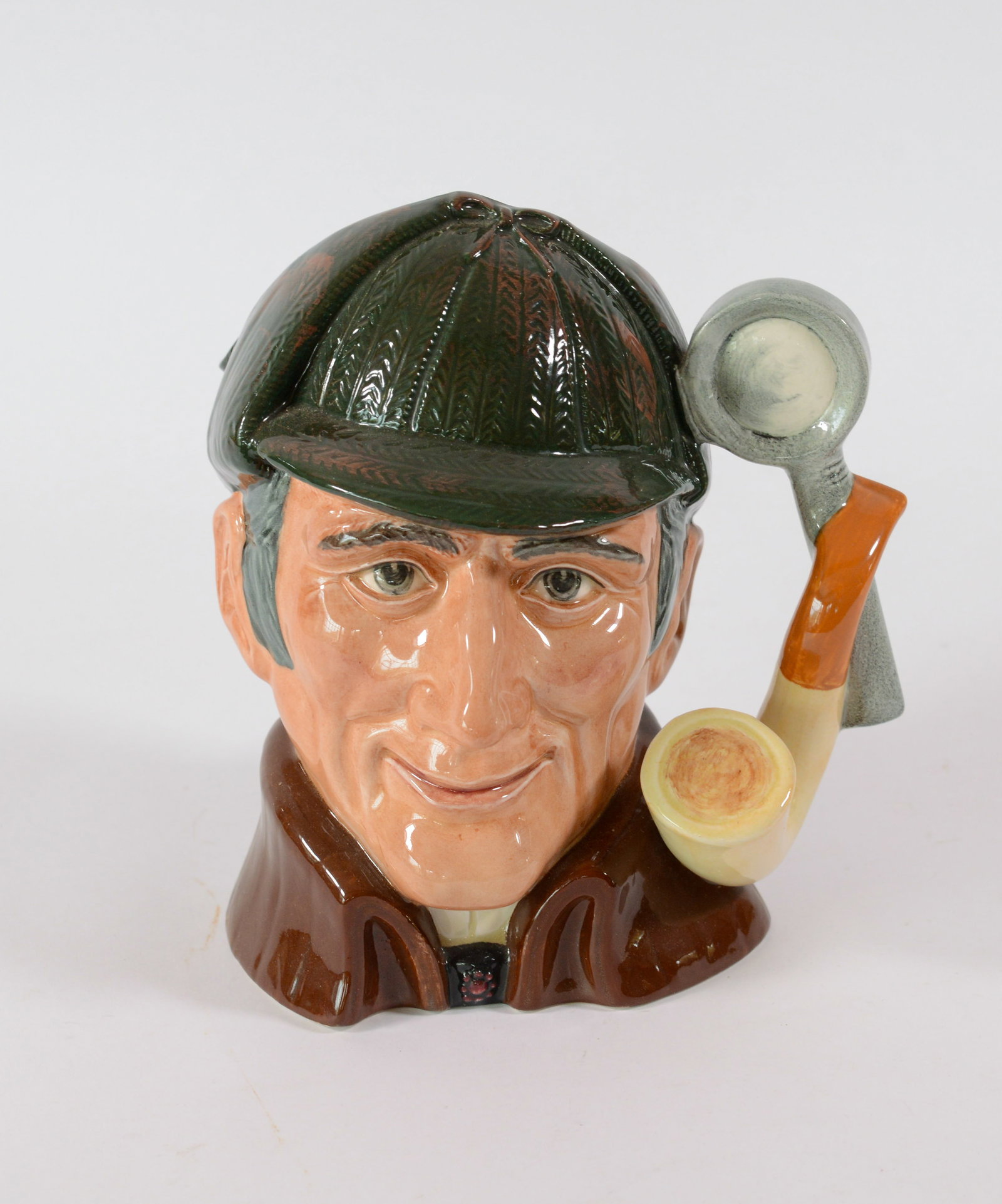 Royal Doulton Pitcher: The Sleuth.: Height 7.5 inches. Good condition.
