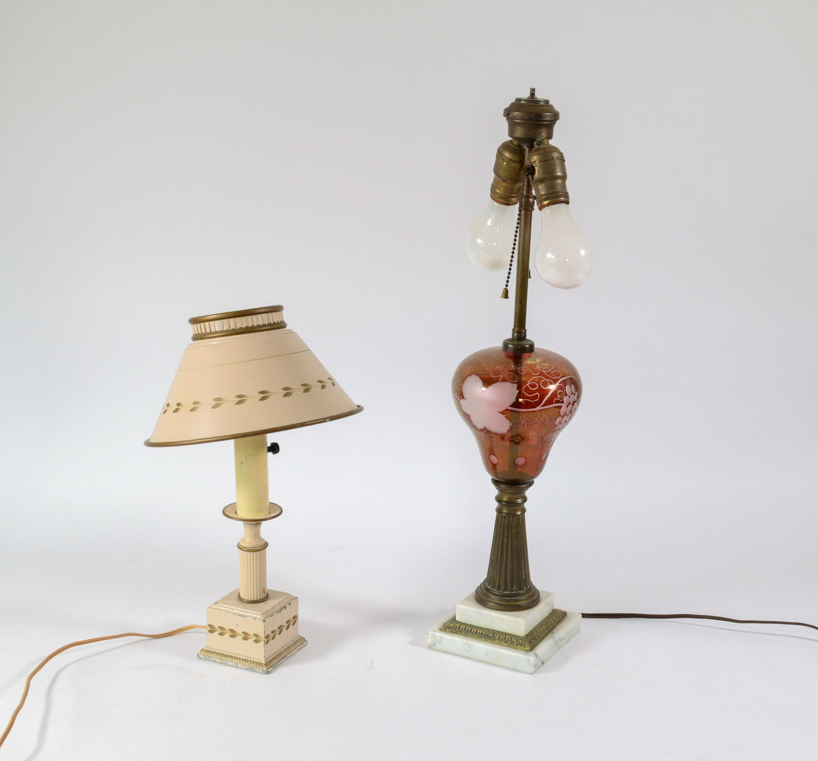 Two Table Lamps.: One cranberry glass, height 23 inches, the other tole.