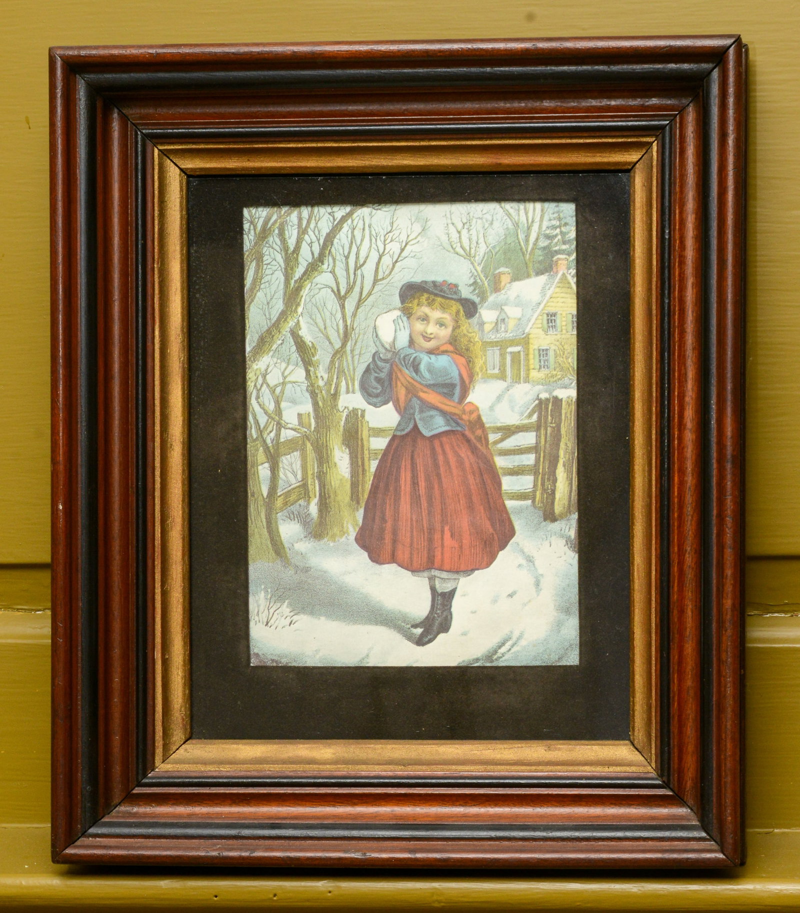 Victorian Lithograph of a Girl With a Snowball.: In a walnut frame, 13.5 x 11.5 inches.