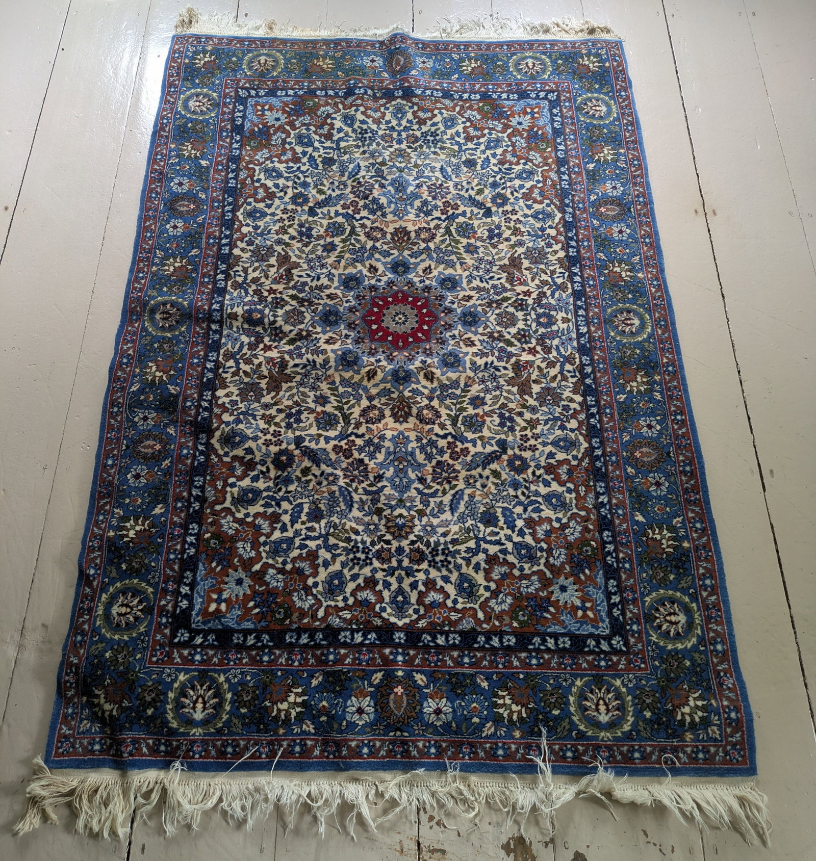 Oriental Carpet With Blue Ground.: 6 feet by 4 feet.