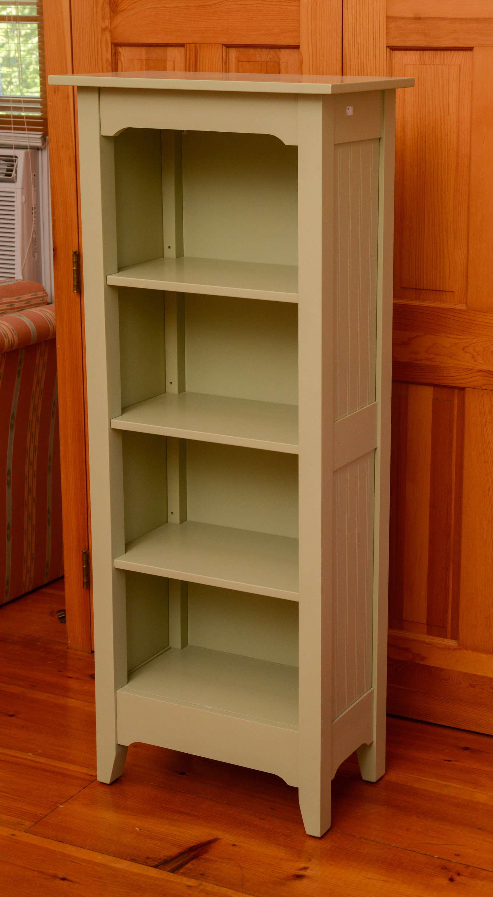 Bookcase in Green.: Height 58 inches, width 21 inches, depth 13 inches.
