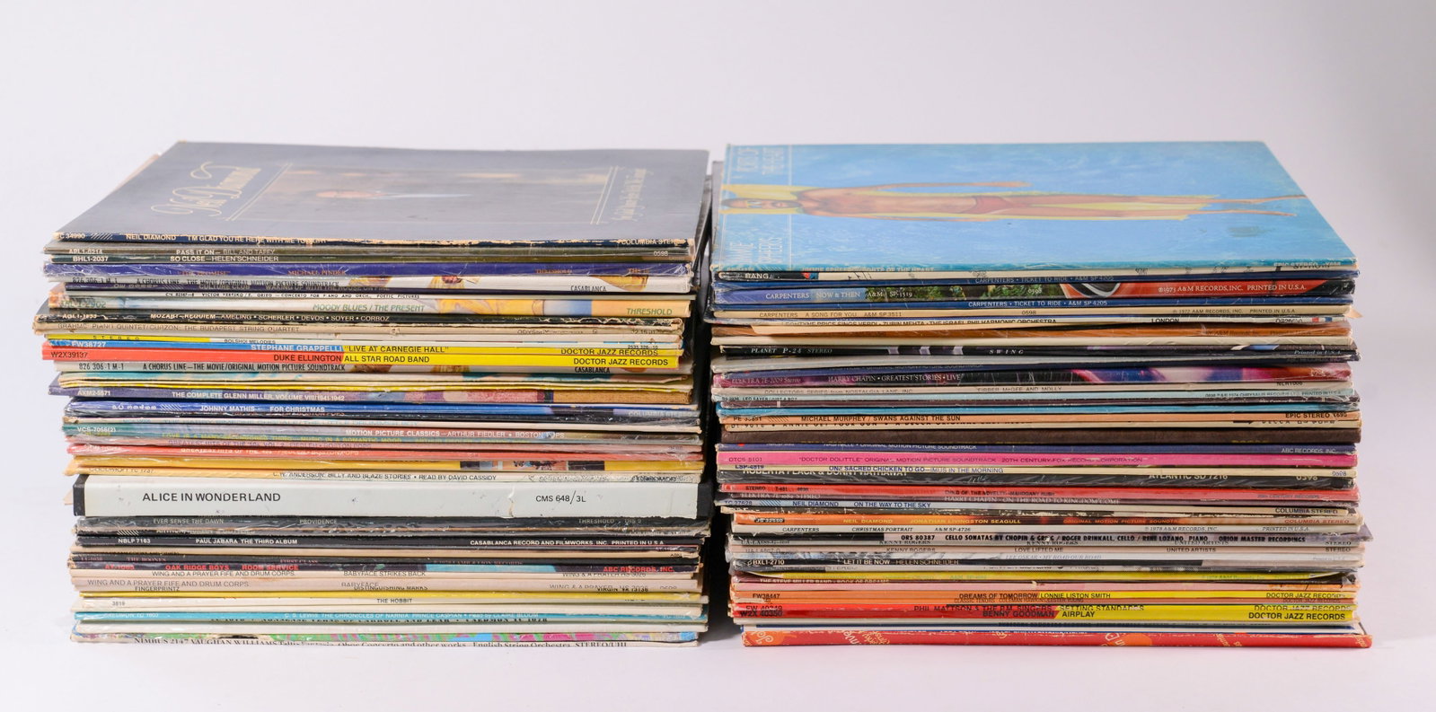 Jane & Jerry Weintraub's Record Collection: Box 1: Includes Duke Ellington, Benny Goodman, Stephane Grappelli, Alice in Wonderland, John Denver, and others. 70+ records. Several promotional copies. A few sleeves missing albums, a few albums missing