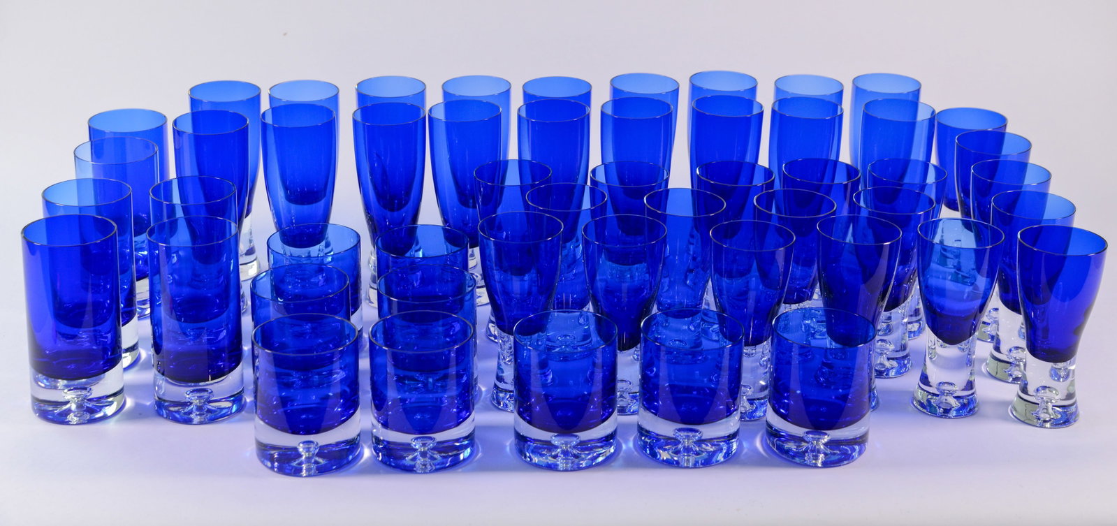 Fifty Four Cobalt Blue Glasses.: Rocks, highball and others. With padded cases.