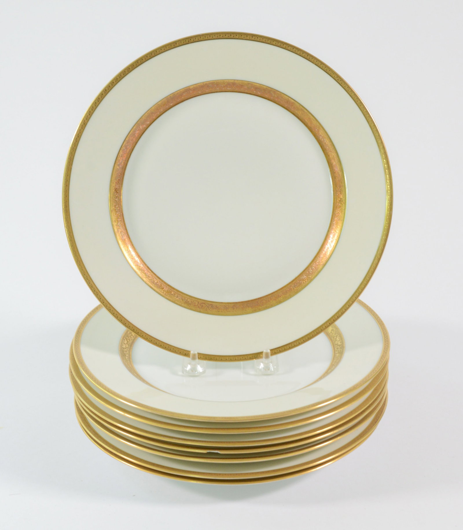 Eight Limoges Gilt Rimmed Dinner Plates.: Diameter 10 inches.