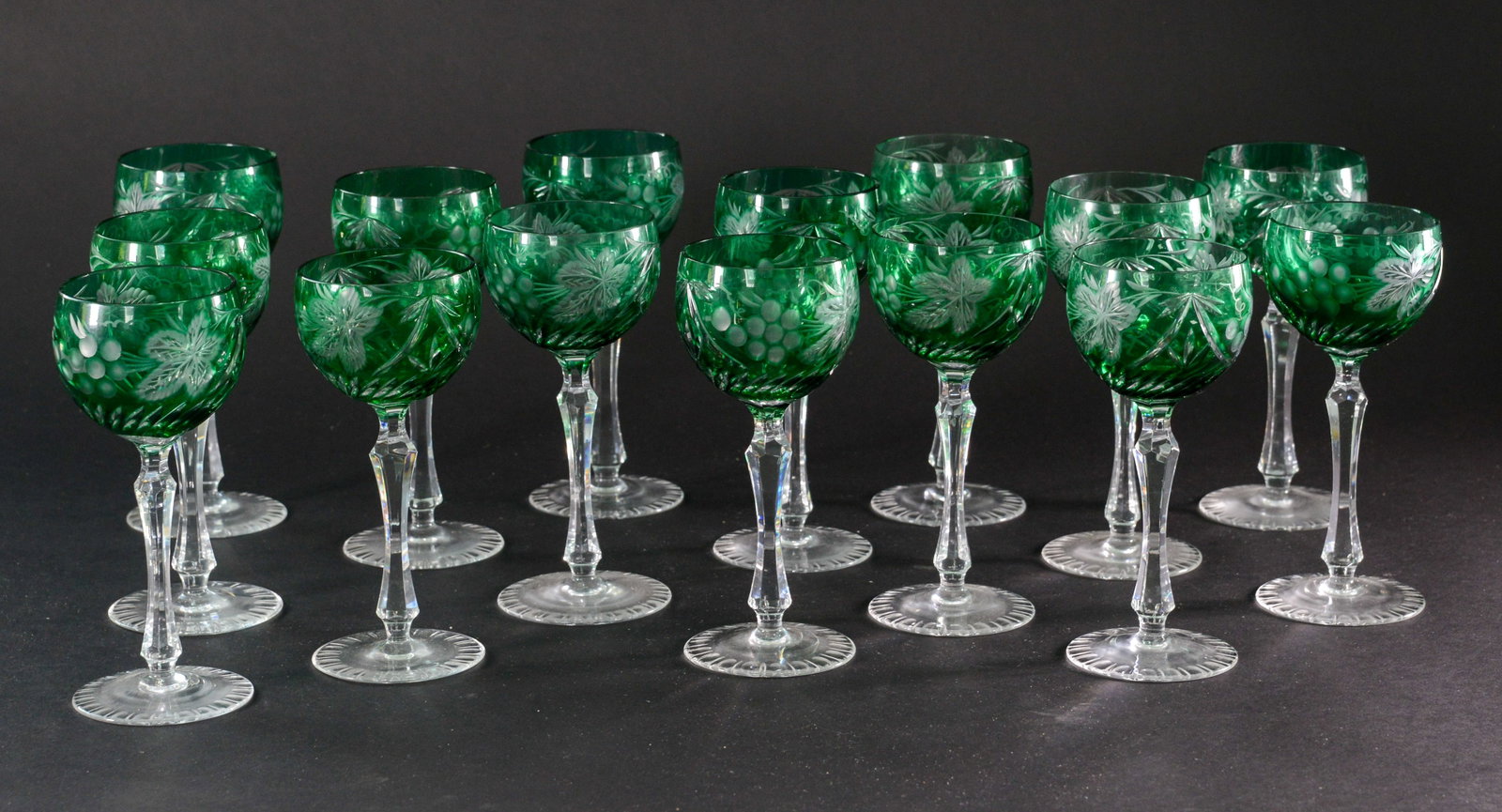 Fifteen Cut Glass Stem Glasses.: Green and clear.
