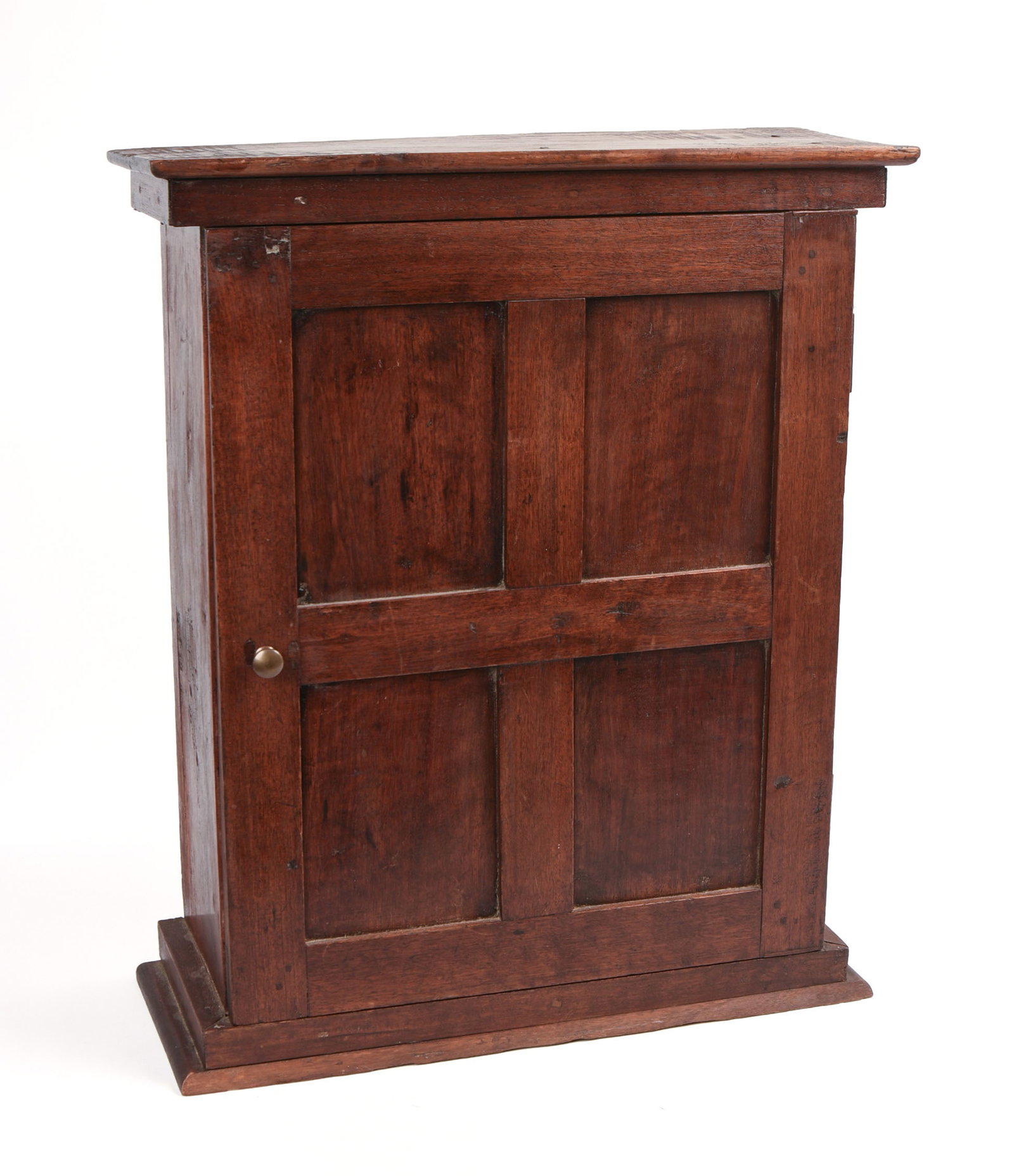 Diminutive 19th Century Mahogany Table Top Cabinet: Having interior shelves over drawer, raised panel door. Height 23 inches, width 18 1/2 inches, depth 7 3/4 inches.