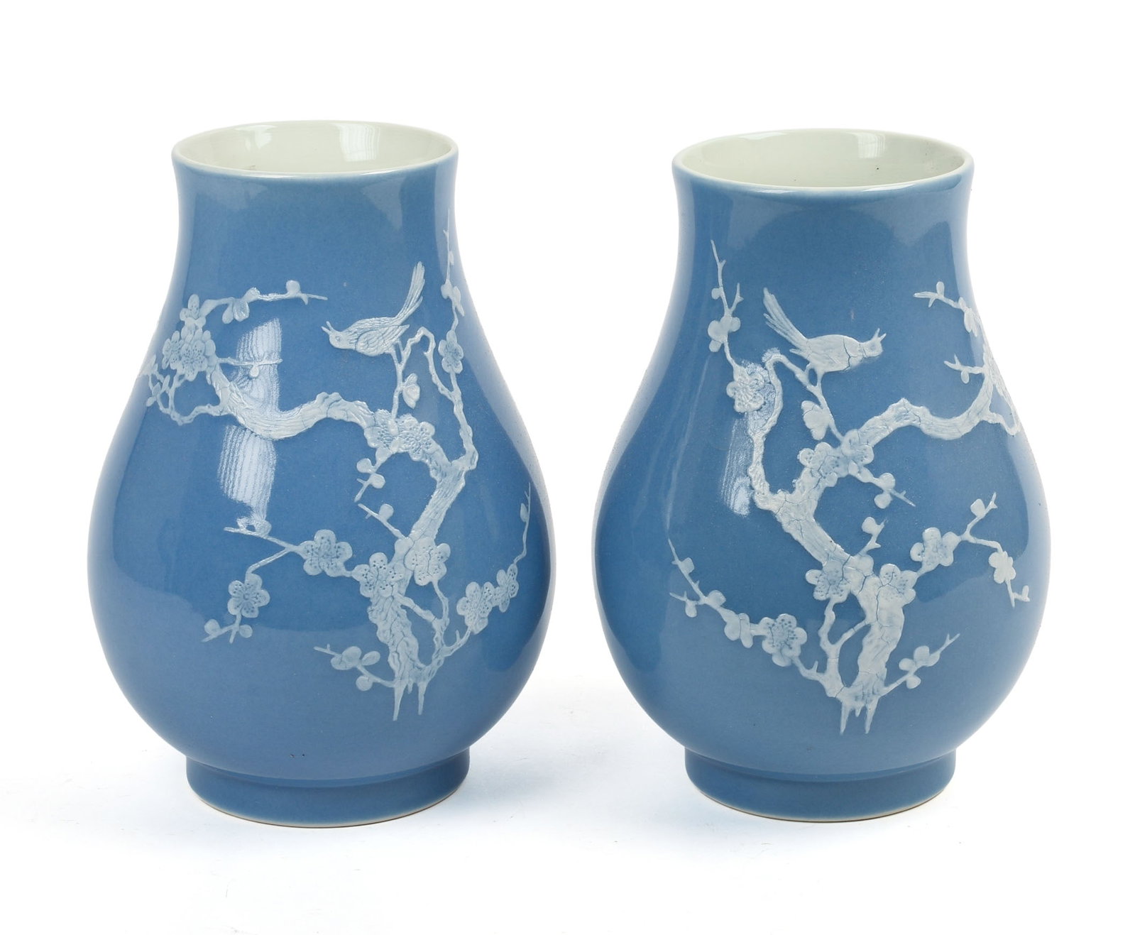 Pair of Chinese Porcelain Vases With Raised Design.: Height 8 inches. Good condition.