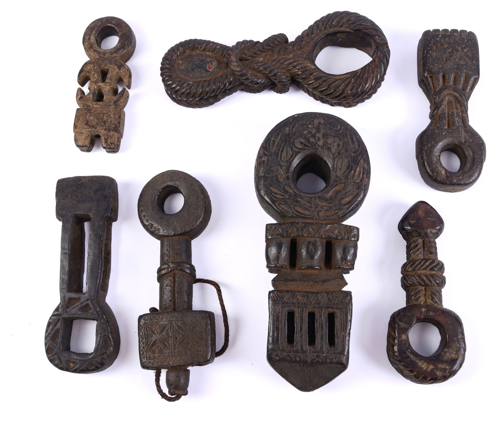 Seven Carved Asian Pieces.: Lengths 6.5 to 11.5 inches.