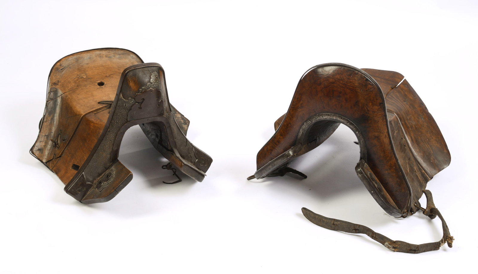 Pair of Small Asian Saddles.: Length 16 inches. One with break.