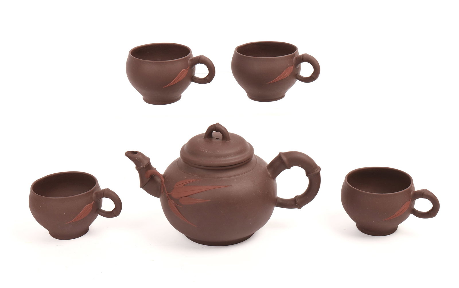 Yixing Teapot and Four Cups.: Height 3.5 inches. In fitted case.