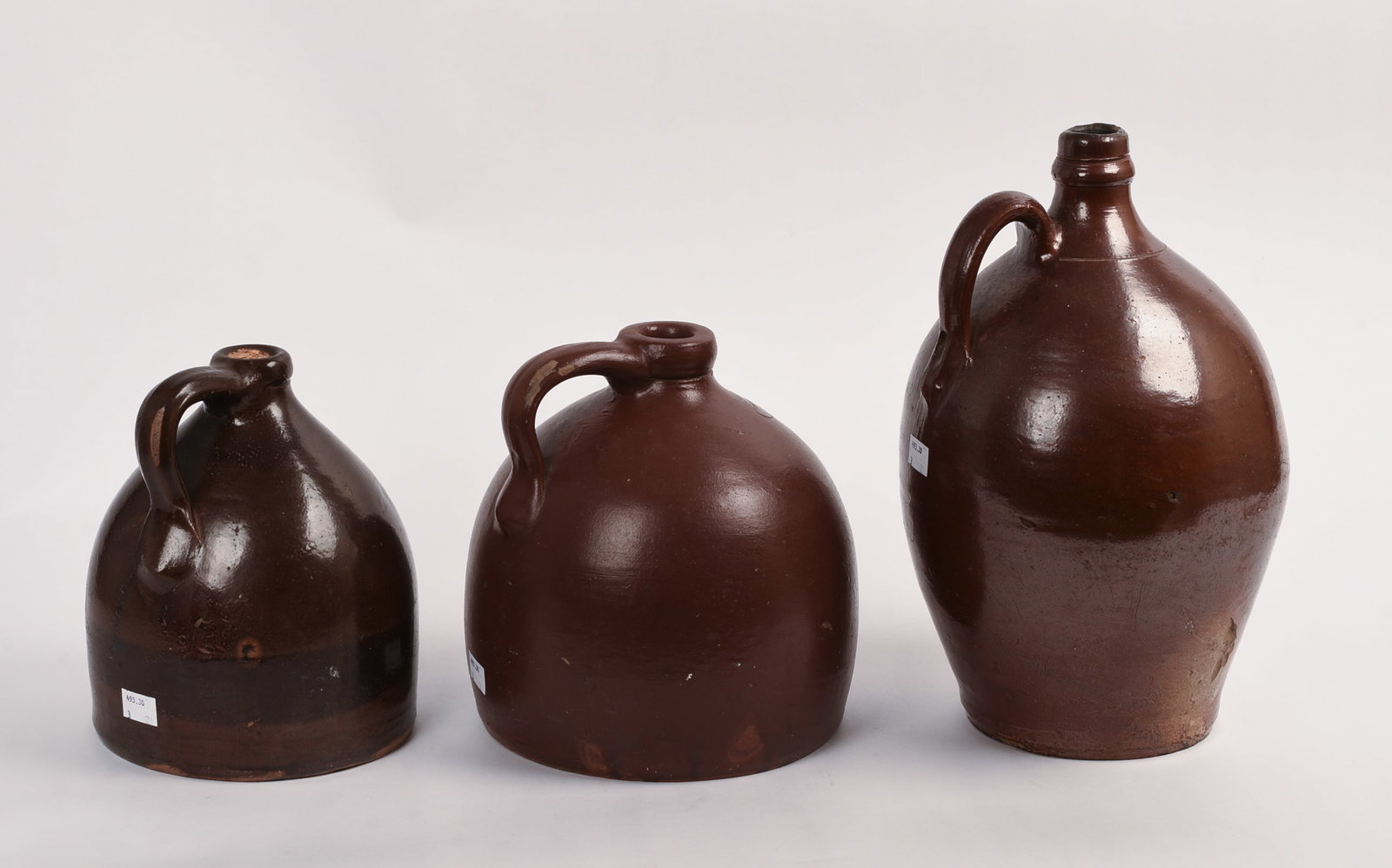Three Redware Jugs. - 3