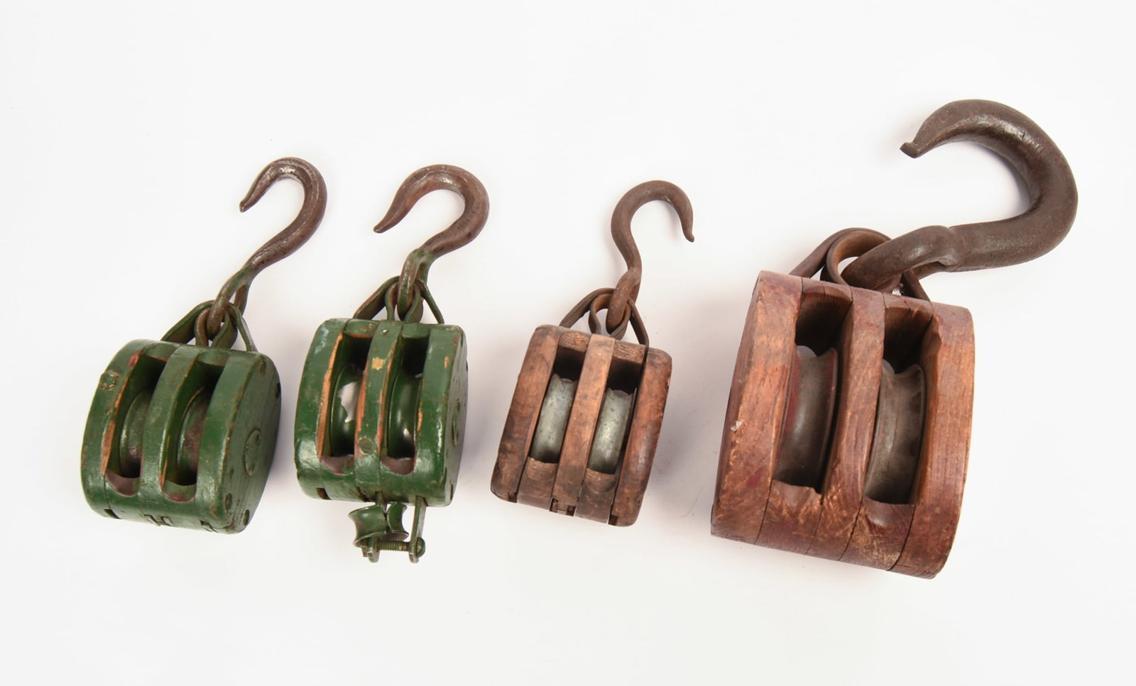Four Antique Pulleys. - 2