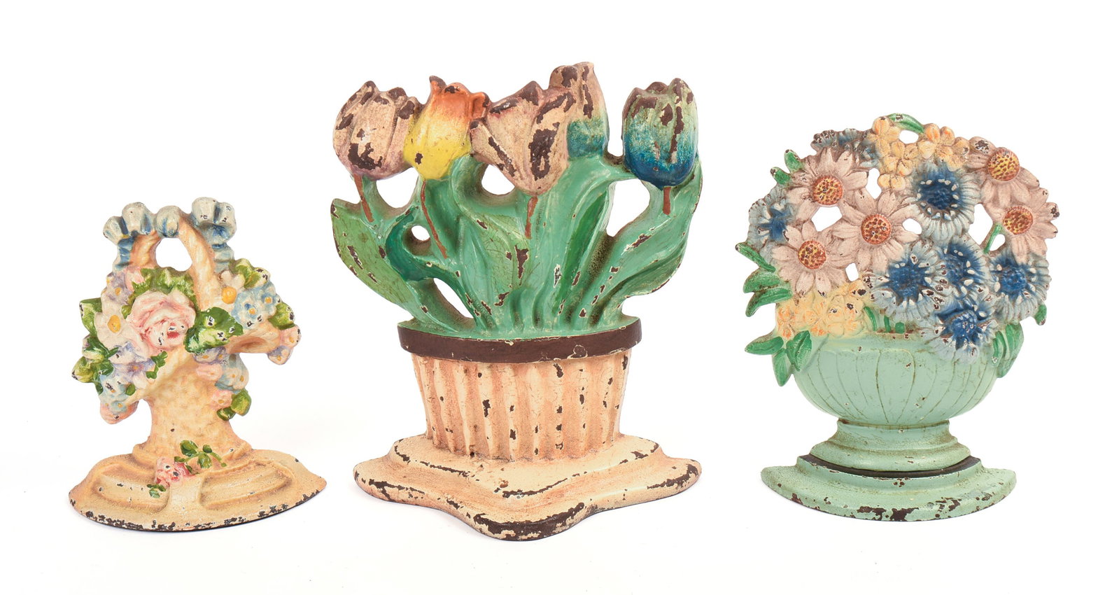 Three Cast Iron Floral Doorstops.: Heights 6, 7.5 and 8.5 inches. Original paint.