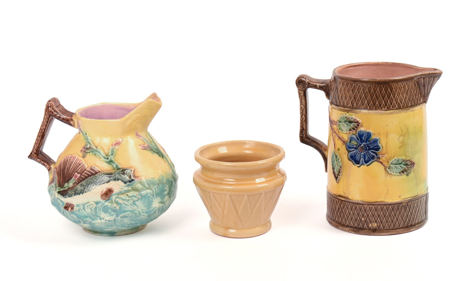 Two Majolica Pitchers and a Yellow Ware Pot. (1 of 8)