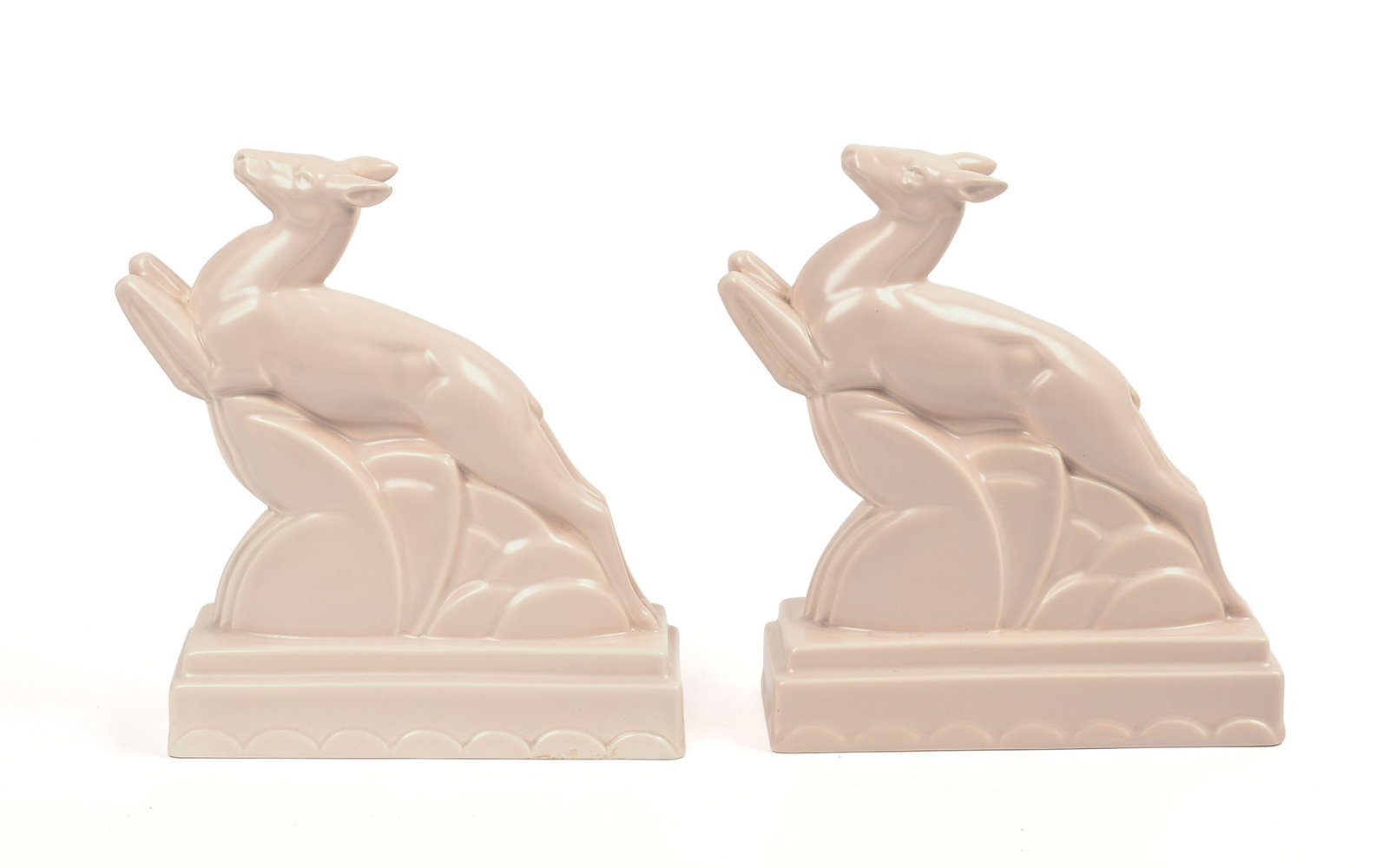 Pair of John Adams for Poole Pottery 'Springbrook' Bookends.: Depicting leaping deer, circa 1926. Height 8 inches.