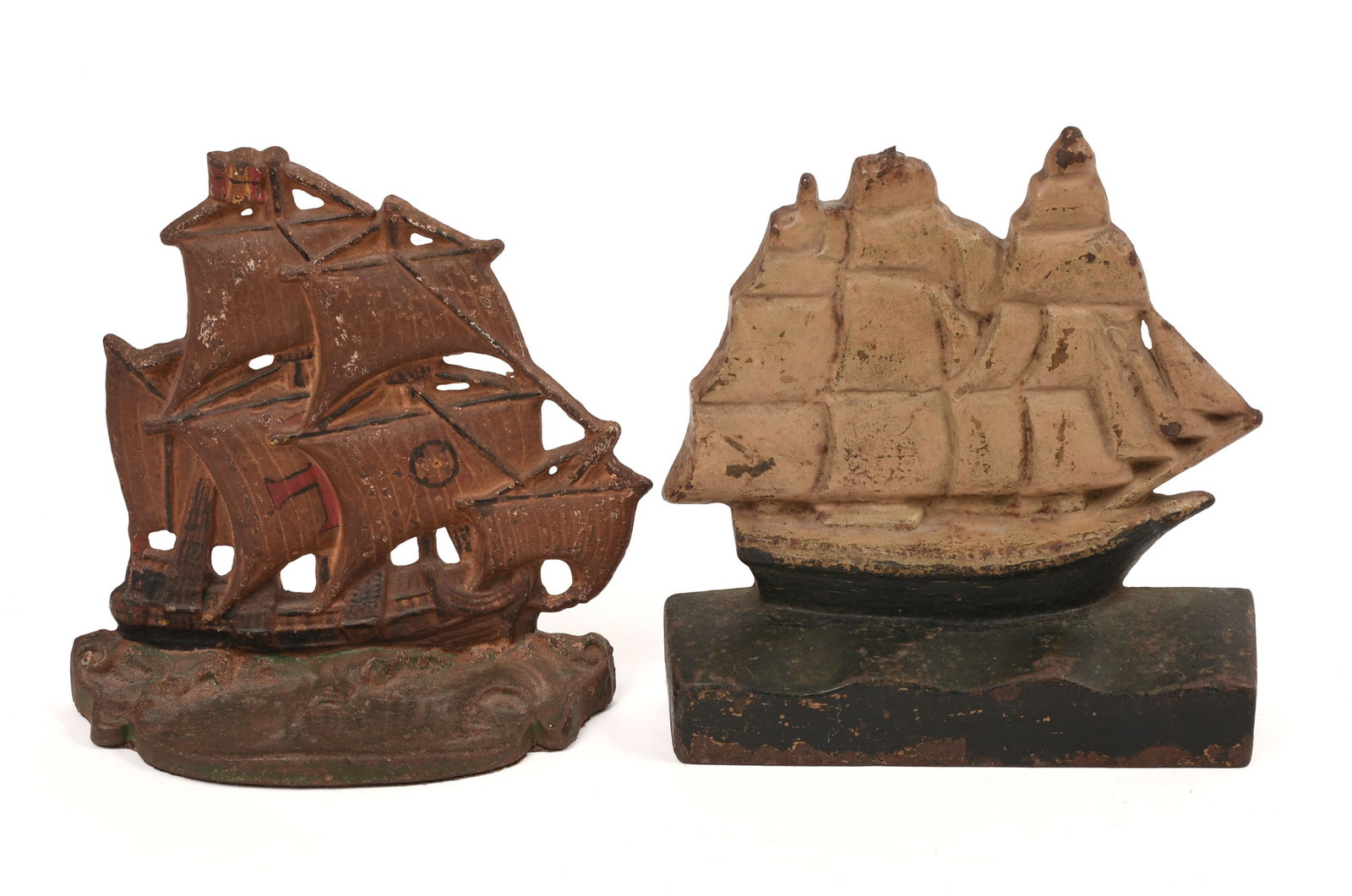 Two Cast Iron Ship Doorstops.: Heights 6.5 inches.
