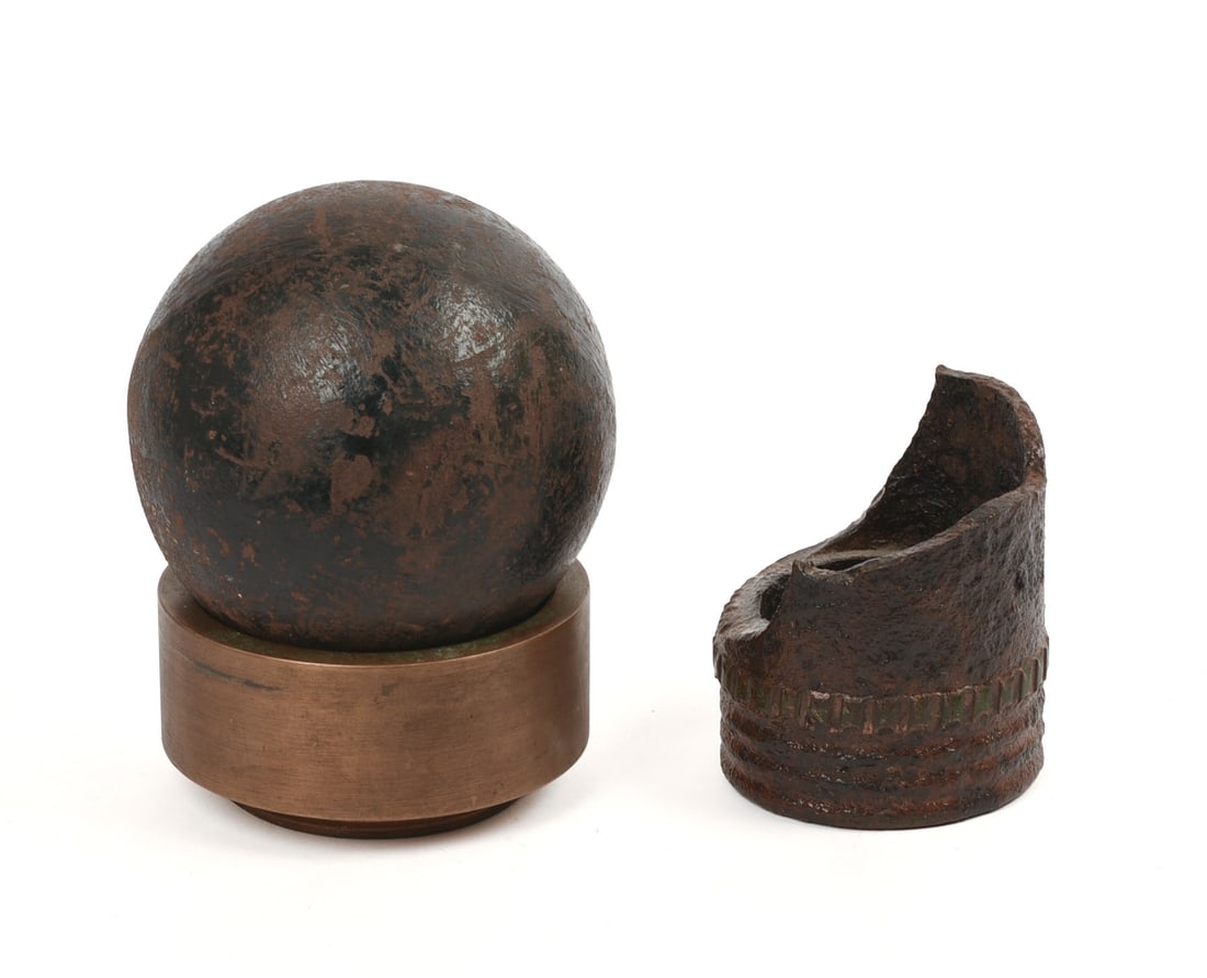 Large Cannonball and a Piece of Shrapnel.: Diameter of cannonball 4.5 inches.
