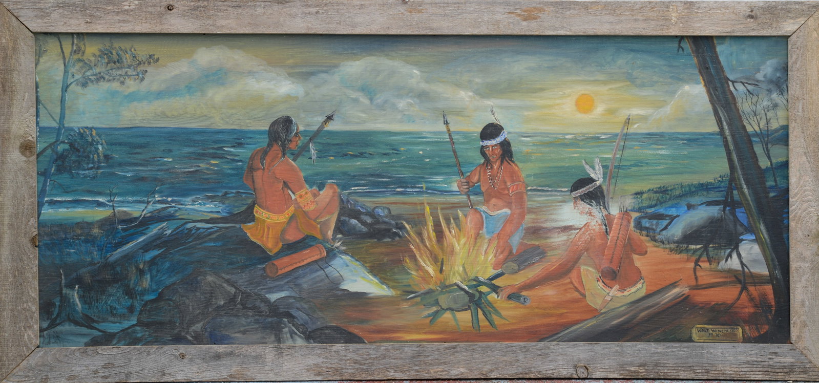 Walt Winchester Painting of Native Americans by a Fire, 1970.: Oil on panel, in barnwood frame, 27 x 57.5 inches.