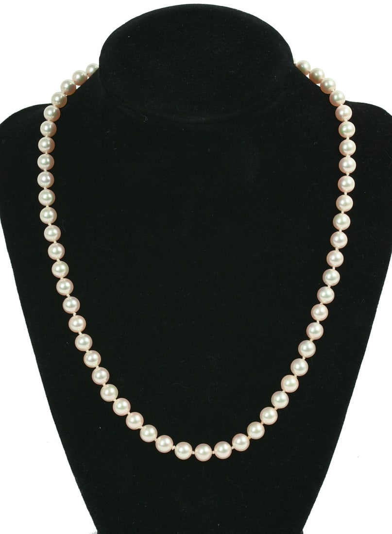Strand of Cultured Pearls: With 14K Gold Clasp, length 18 inches.