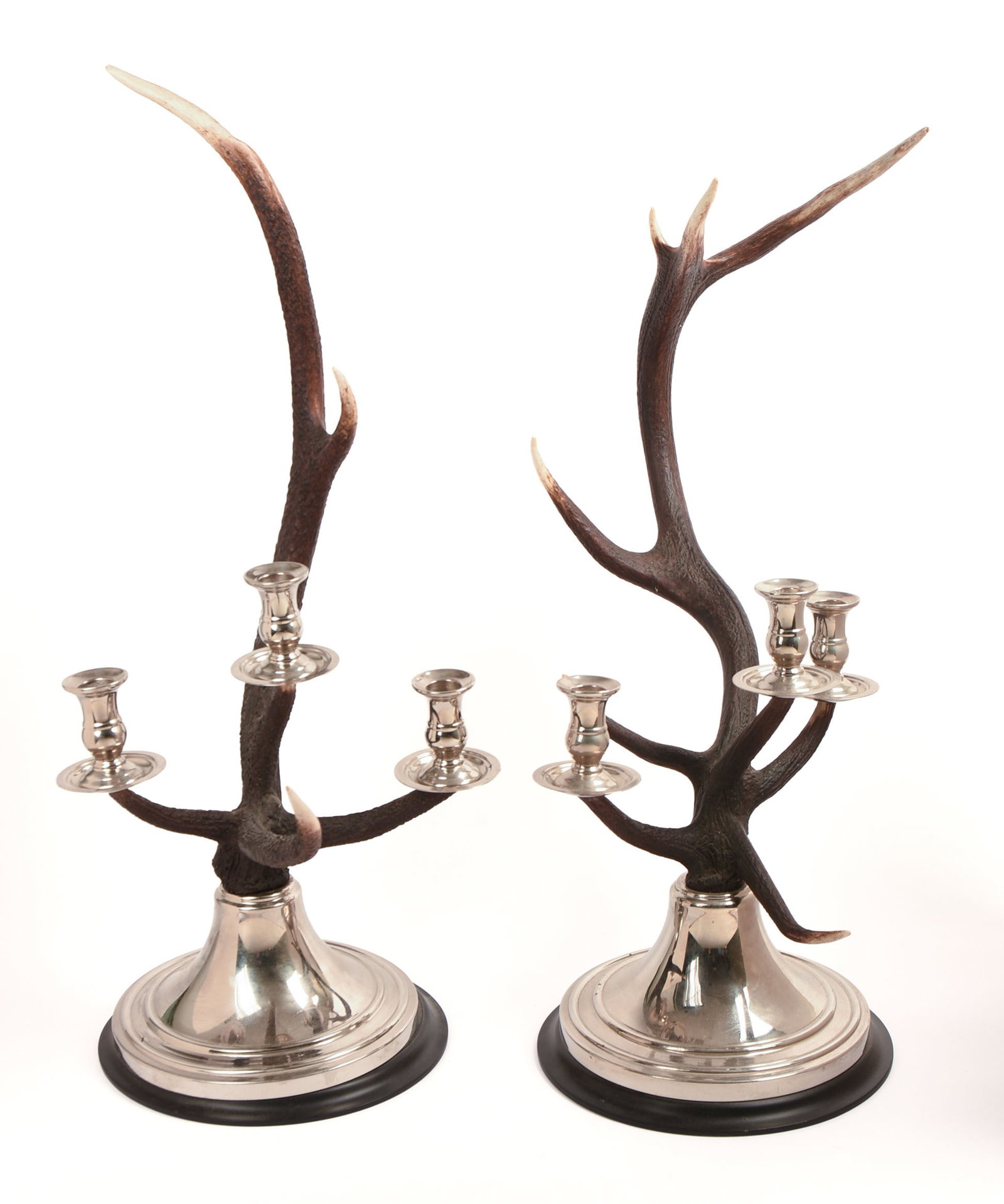PAIR OF RALPH LAUREN CHANNING STAG CANDLESTICKS.: Heights 26 and 30 inches. Each with one well repaired break (see photos). One base loose, chip to one antler. Original retail price $2,295 each