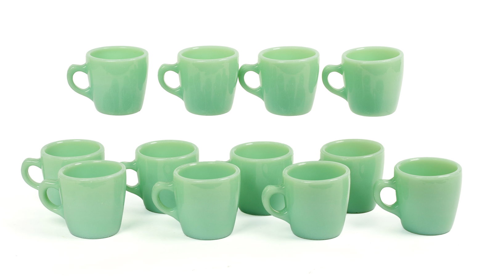 Twelve Jadeite Fire King Mugs: Height 3 inches, good condition.