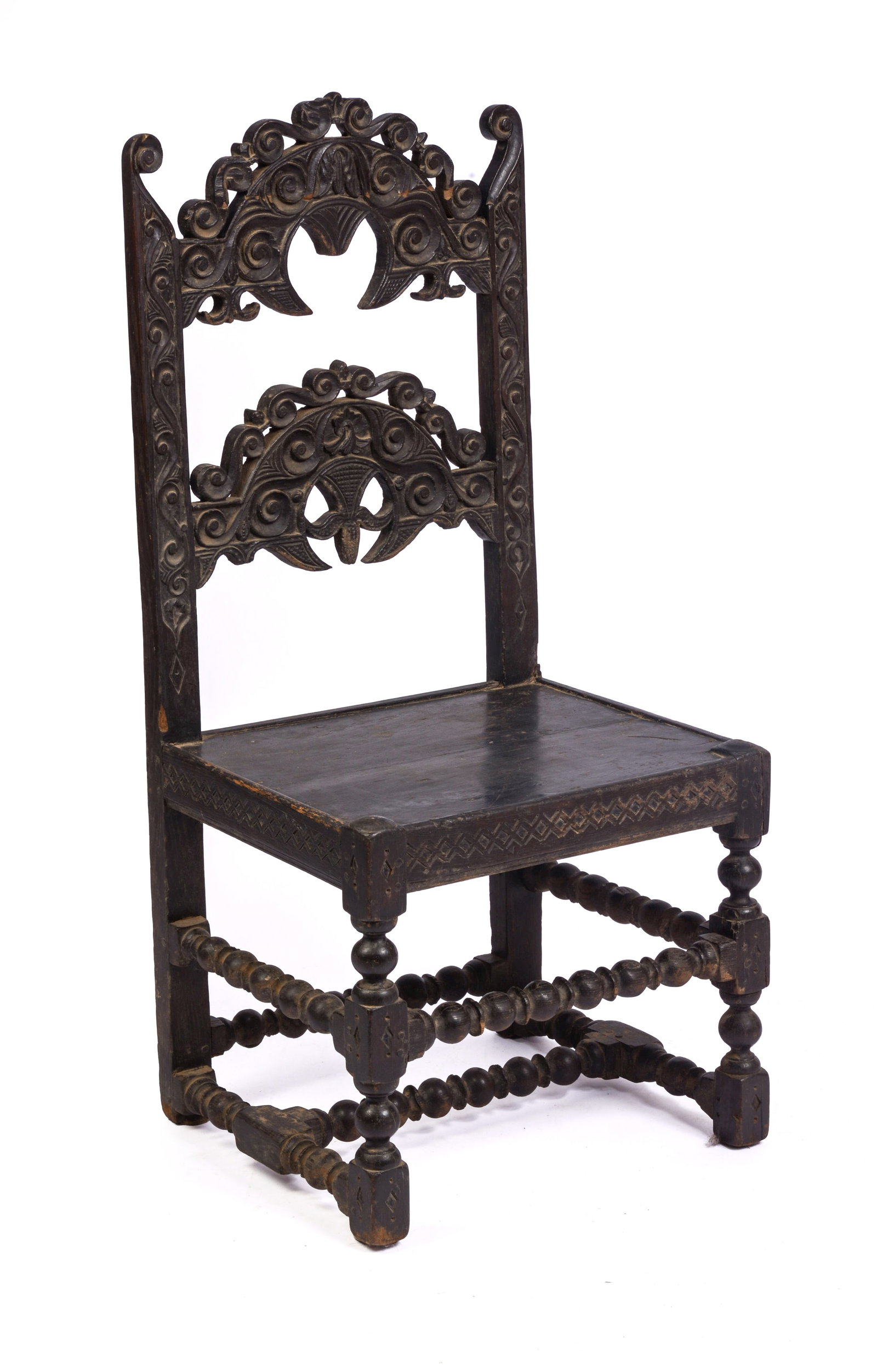 YORKSHIRE CARVED BACK STOOL, CIRCA 1670 - 1690.: Shaped back crest with carved scrolls and drop pendants. By repute, the carved center of the back rail covertly represents the head of Charles I, and the acorn from the oak tree in which he hid after