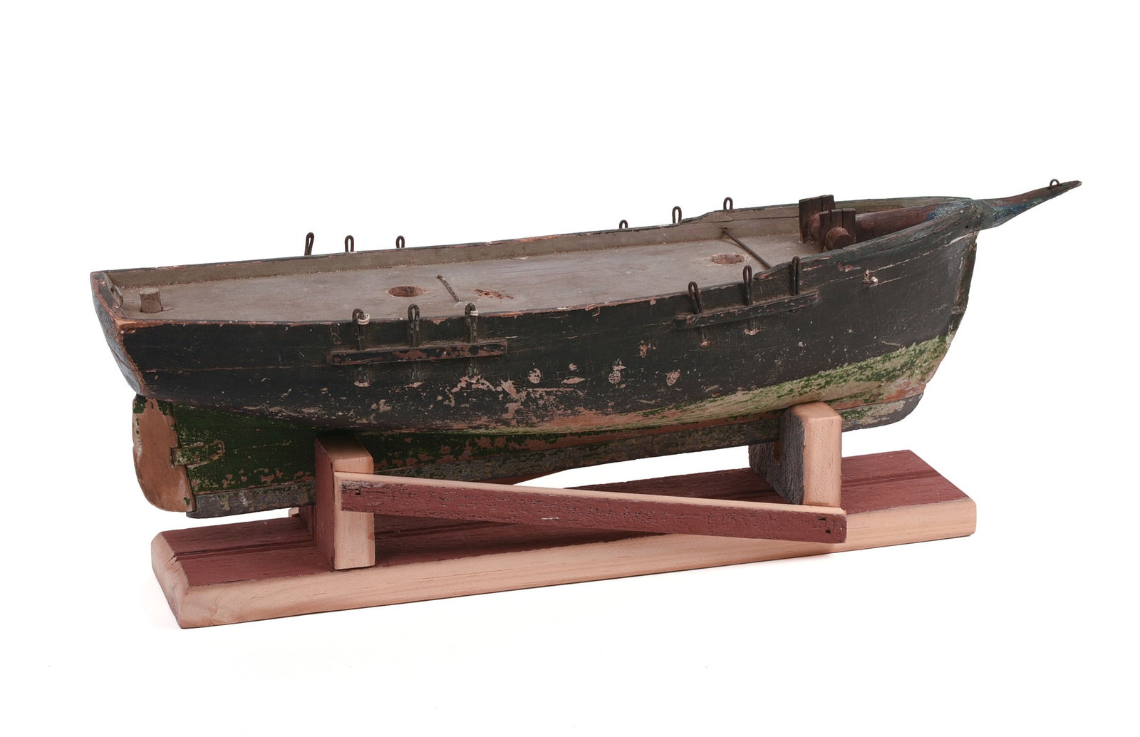 FOLK ART SCHOONER MODEL.: Circa 1910, in original paint. With later professionally made base. Length 19 inches. 