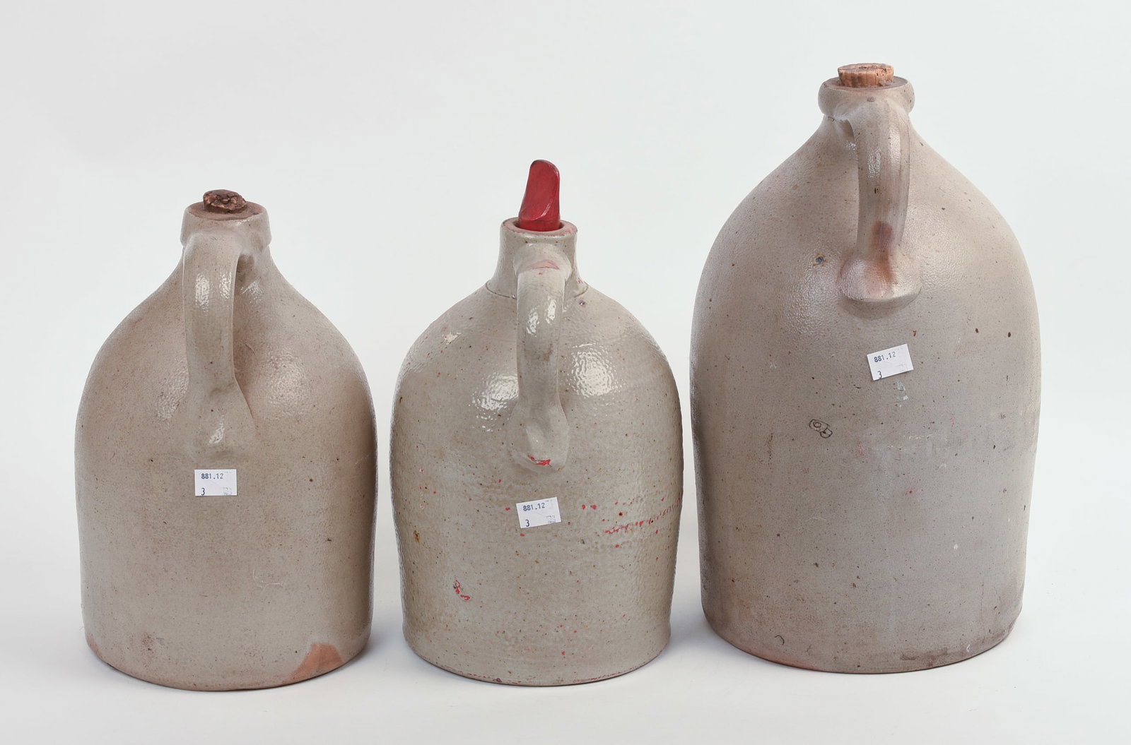 THREE STONEWARE JUGS. - 4