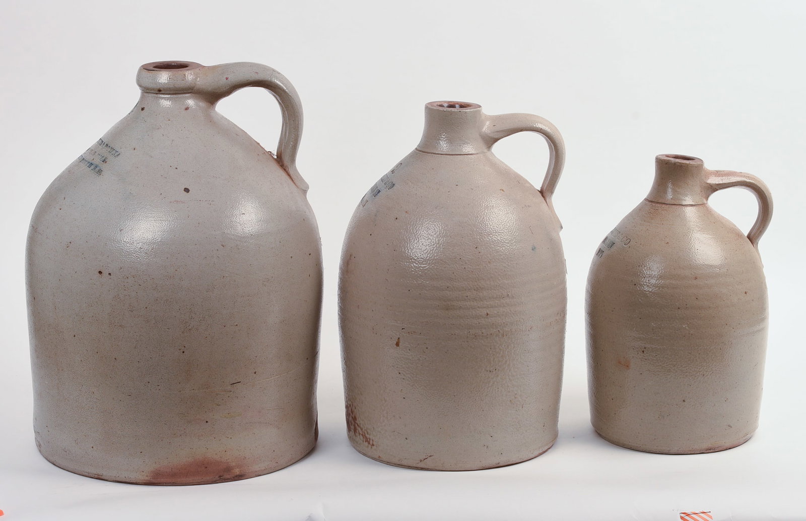THREE STONEWARE JUGS. - 5
