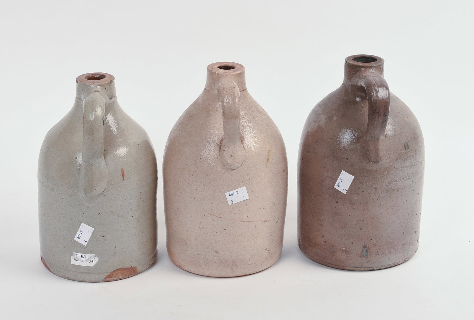 THREE SMALL STONEWARE JUGS. - 3