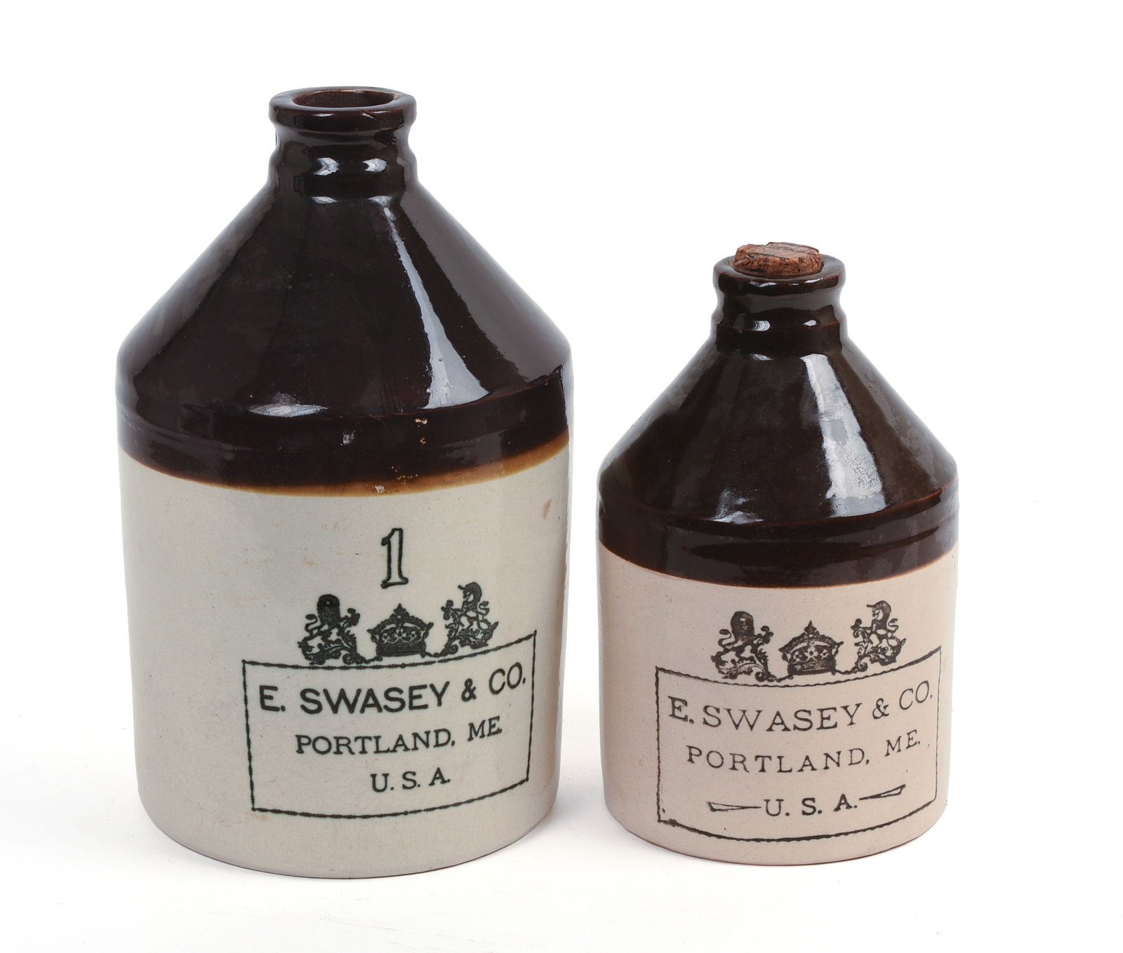TWO E. SWASEY & CO. STONEWARE CROCKS.: Heights 9.5 and 12 inches. Each with chip at base.
