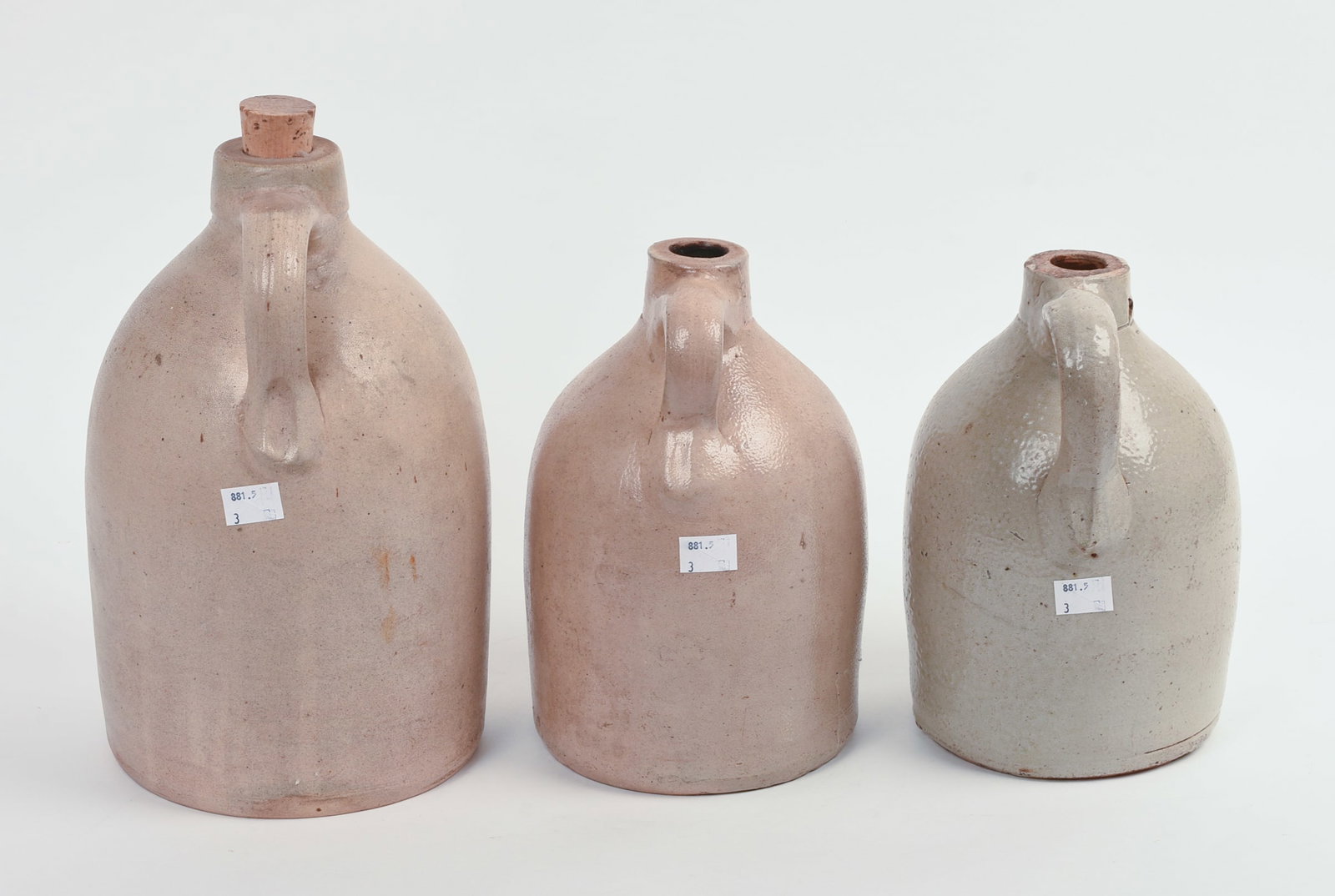THREE STONEWARE JUGS. - 3
