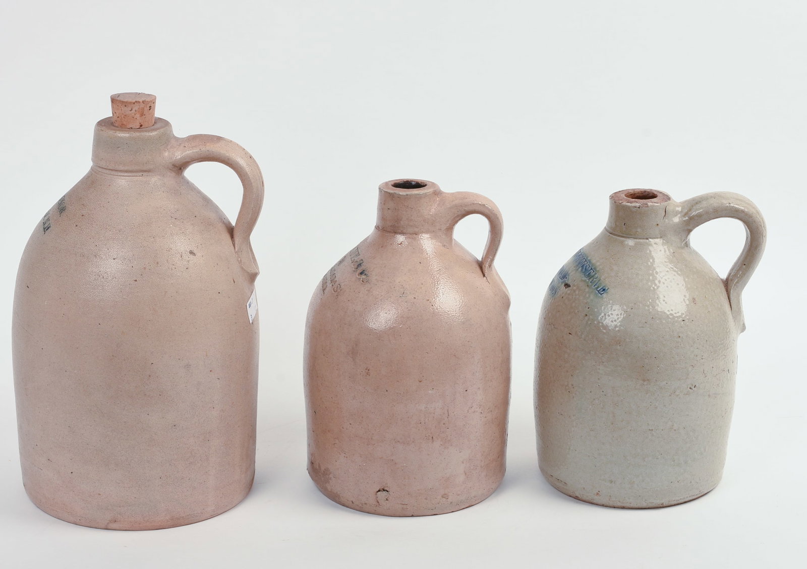 THREE STONEWARE JUGS. - 4