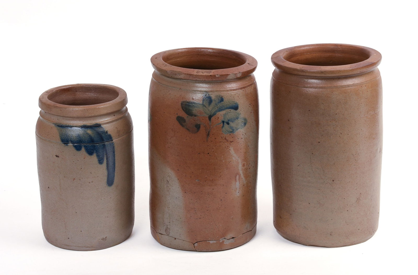 THREE STONEWARE CROCKS.: Heights 8.5 and 10.5 inches. Some chips, largest with repaired break to base.