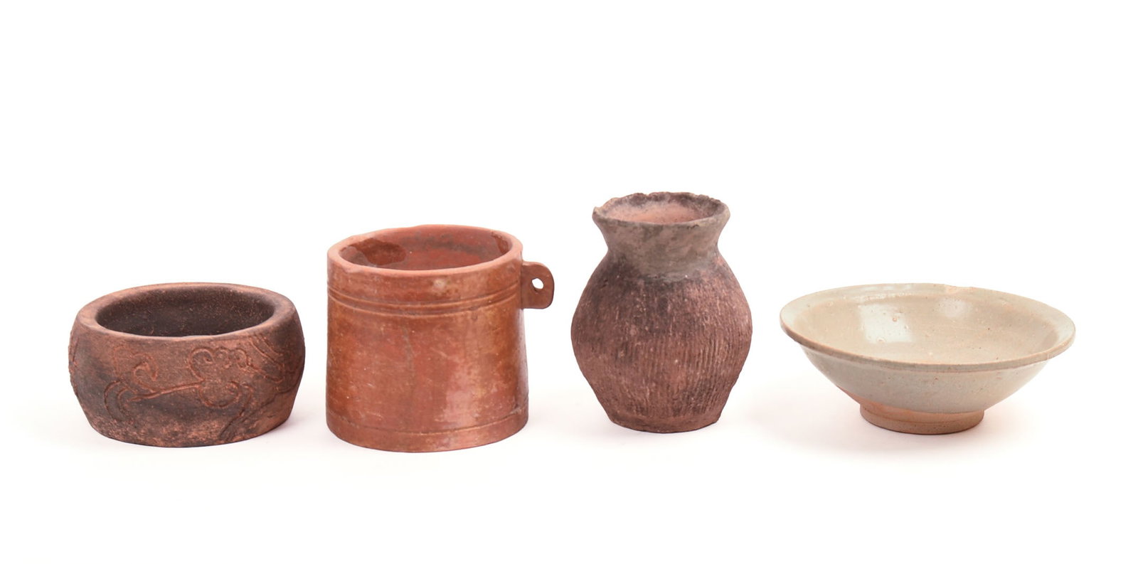 FOUR EARLY CHINESE CERAMIC PIECES. (1 of 6)