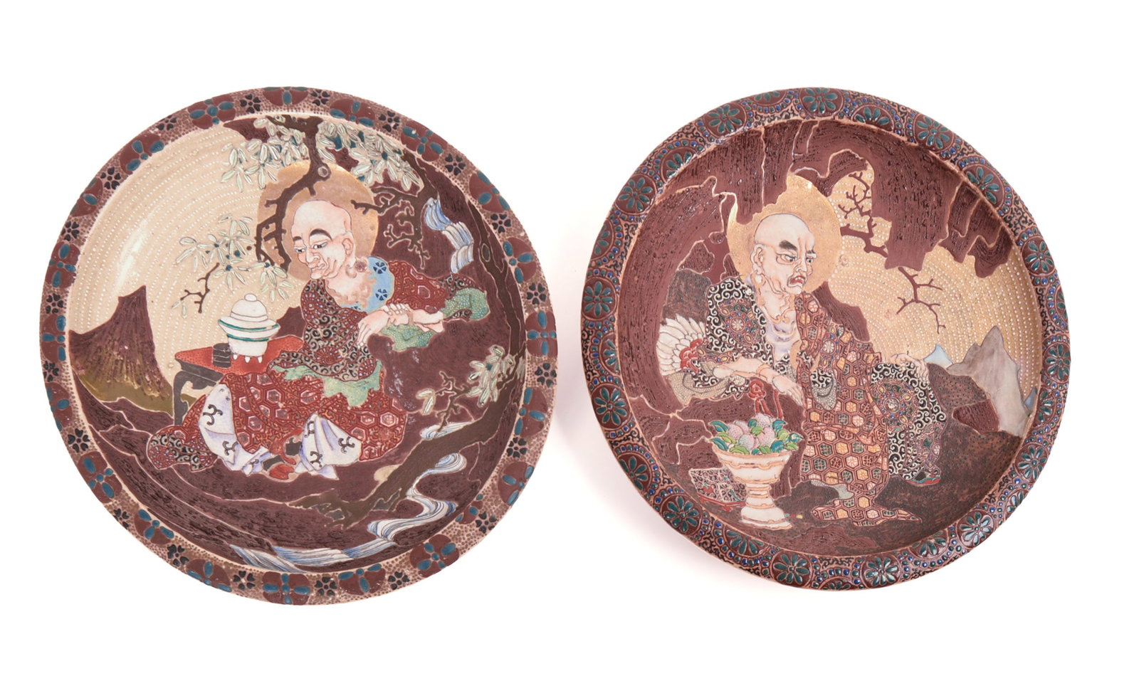 RARE 19TH CENTURY PAIR JAPANESE SATSUMA CHARGERS.: Late Edo to early Meiji period, depicting Rakans (Luohans). Width 12 inches. Hairline on back of one charger.