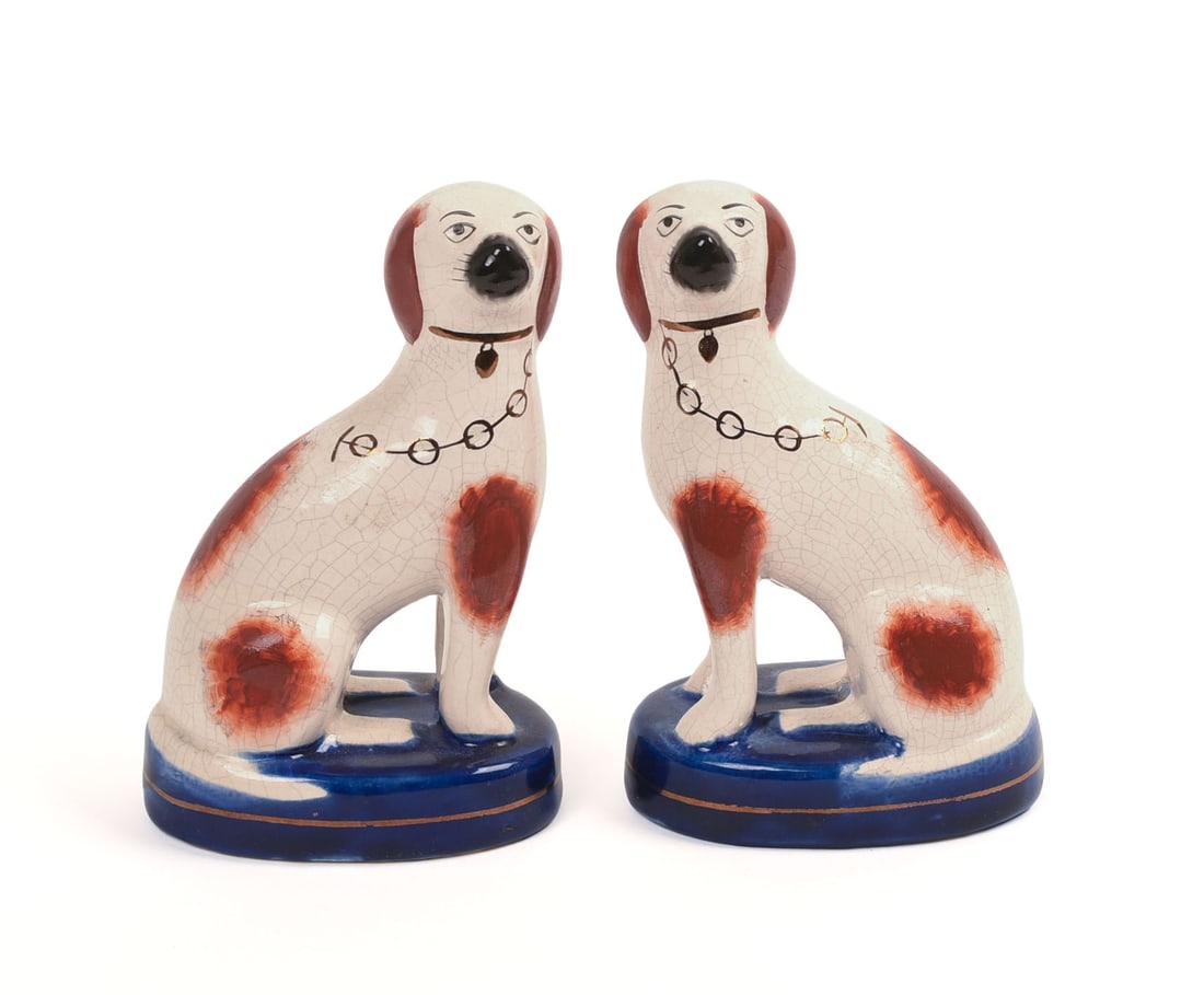 PAIR OF STAFFORDSHIRE POTTERY DOGS.: Cobalt bases. Height 5 inches.