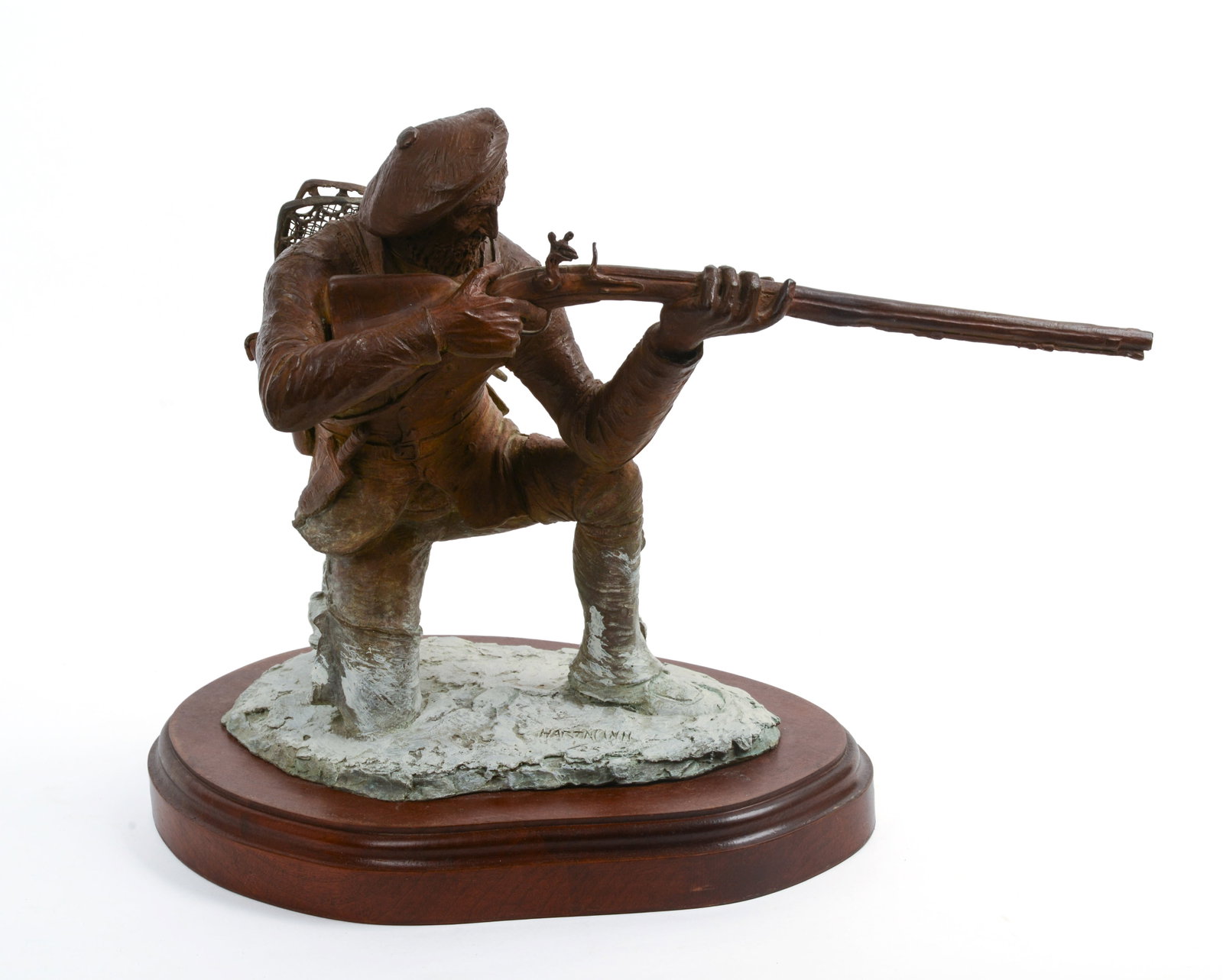 JUD HARTMANN (B. 1948). KNEELING FRENCH TRAPPER TAKING AIM.: Signed at base. Height 17 inches, length 19 inches, depth 11 inches. 