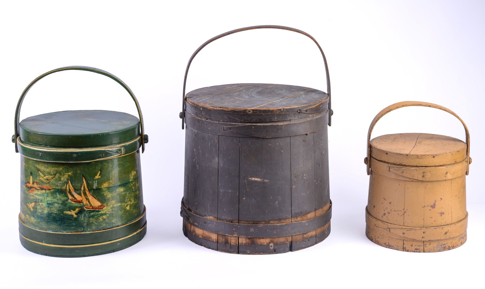 THREE PAINTED FIRKINS.: One in yellow paint (height 9 inches), one decorated with scene of Portland Head Light by Merilda Y Austin, and one in old black paint.