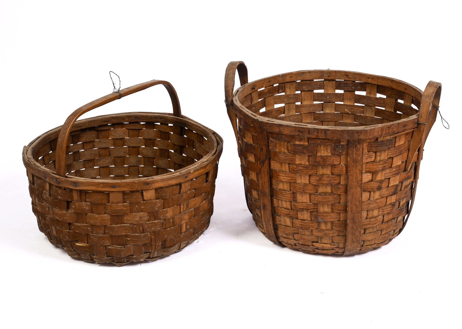 TWO LARGE ANTIQUE BASKETS.: Diameter 18 inches.