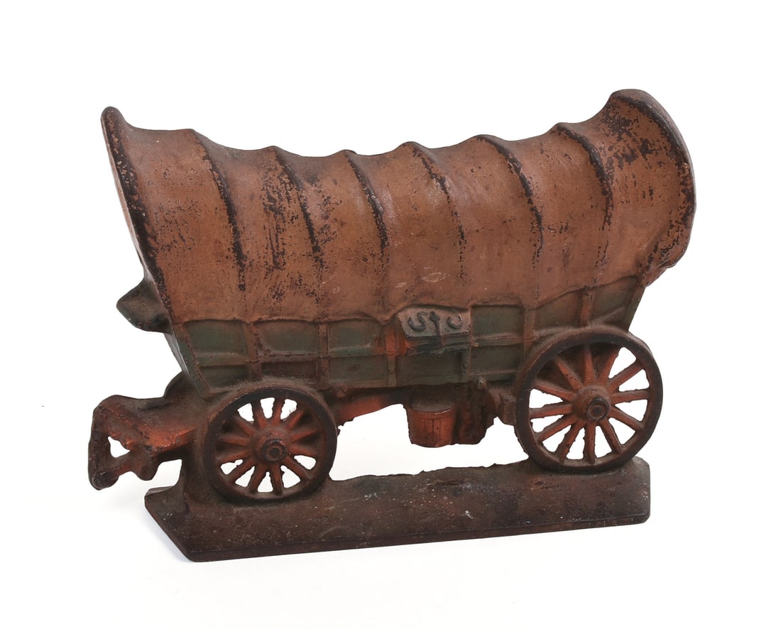 CAST IRON CONESTOGA WAGON DOORSTOP.: Original paint. 11.5 x 8.5 inches.