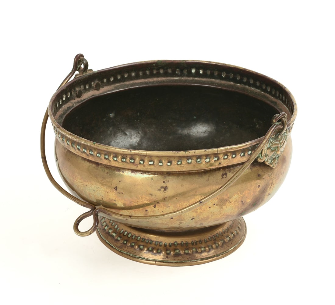 17TH CENTURY DUTCH BRASS HANGING POT.: With repousse decoration, circa 1650. Diameter 8.25 inches.