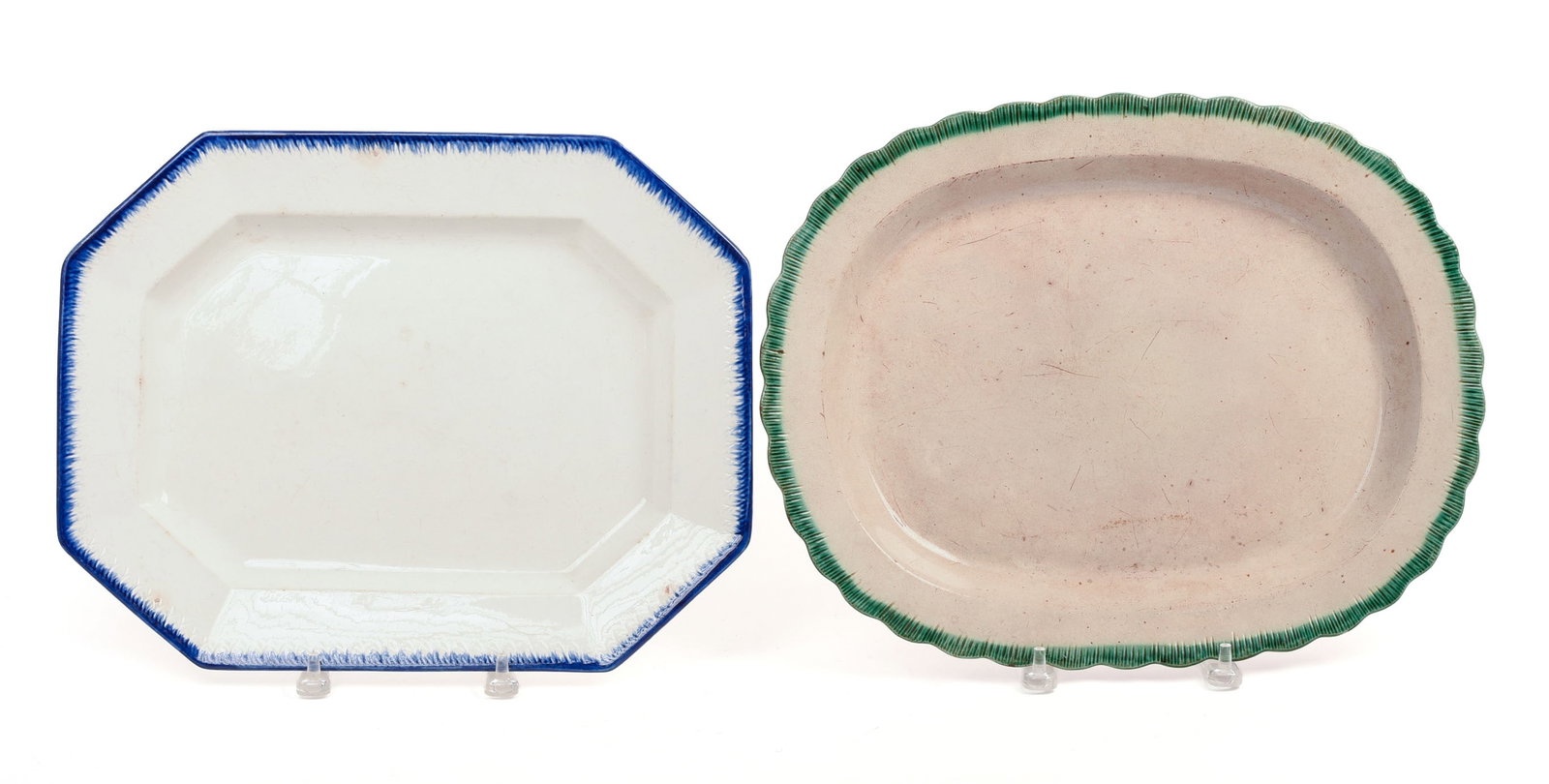 TWO ENGLISH LEEDS PEARLWARE PLATTERS.: One with green feathered edge (17 x 13 inches), the other with blue feathered edge and marked 'Best Goods.'